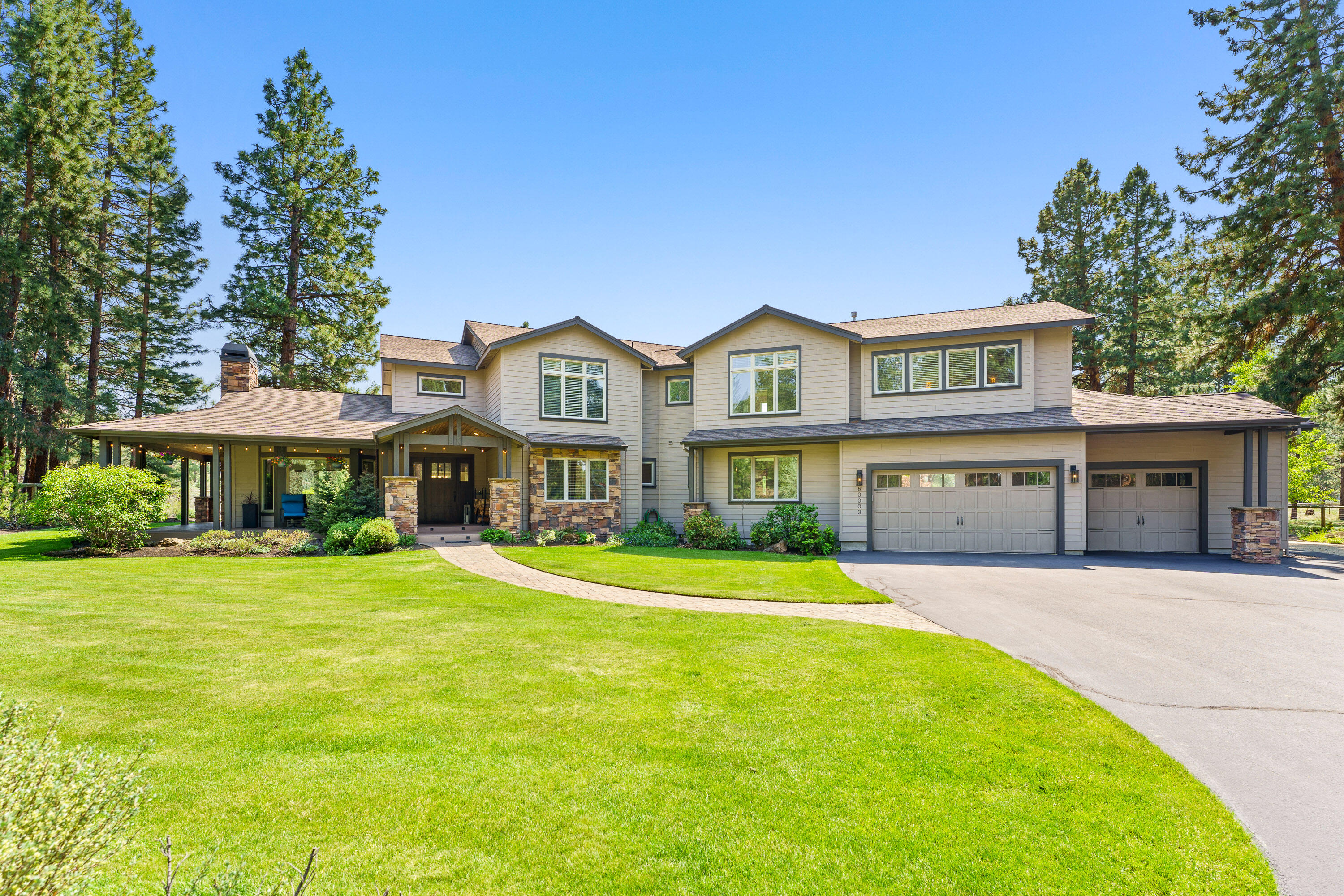 Set on over two acres, this gated, beautifully manicured property in desirable Woodside Ranch offers privacy in a park-like setting. The stunning 4,510 sf remodeled home offers 5 bedrooms, 4.5 baths, vaulted great room, separate living room, formal dining room bonus room and office, all with tons of windows and fabulous natural light. Featuring a tasteful kitchen with views of the expansive backyard and outfitted with an oversized Jenn Air gas range, double ovens, large pantry, updated cabinetry, and pot filler faucet. Additional amenities include white oak floors, new carpet, 3 fireplaces (two propane and one wood burning), forced air heat, A/C, central vacuum, and an oversized 3 car garage. Outside features include a wrap around porch with multiple seating areas, built in BBQ, gas firepit, hot tub, built in planter boxes, playground, chicken coop, storage shed, garden beds, and RV parking; fully fenced in and bordering National Forest property. This is a Bend, Oregon gem!