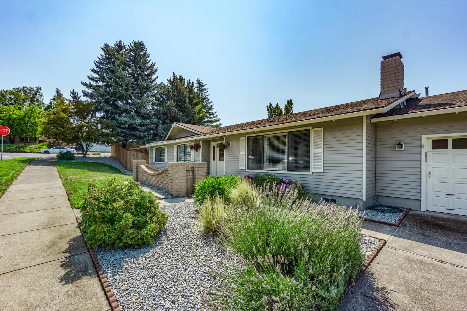 Welcome to this single level home on a large corner lot with RV parking just one block away from Lone Pine School. Offering 3 bedrooms, 2 full bathrooms & family room could be used for home office or game room. Wood burning fireplace in living room. Pride of ownership shows with many updates including new paint inside & outside and inground sprinklers in the front. There are three nice sized bedrooms with the master having double sinks. Crown molding in living, dining and family rooms. Newer carpet and vinyl flooring throughout the entire home. Kitchen has granite counter tops with newer dishwasher and stove installed within the last year. The large pantry has even more shelving space and the laundry has plenty of storage. There are newer LED lights throughout. Fenced back yard offers plenty of options for garden area, covered patio and open concrete area for BBQ & kids to play. Lastly, the garage has plenty of space and the widened driveway allows for plenty of parking.
