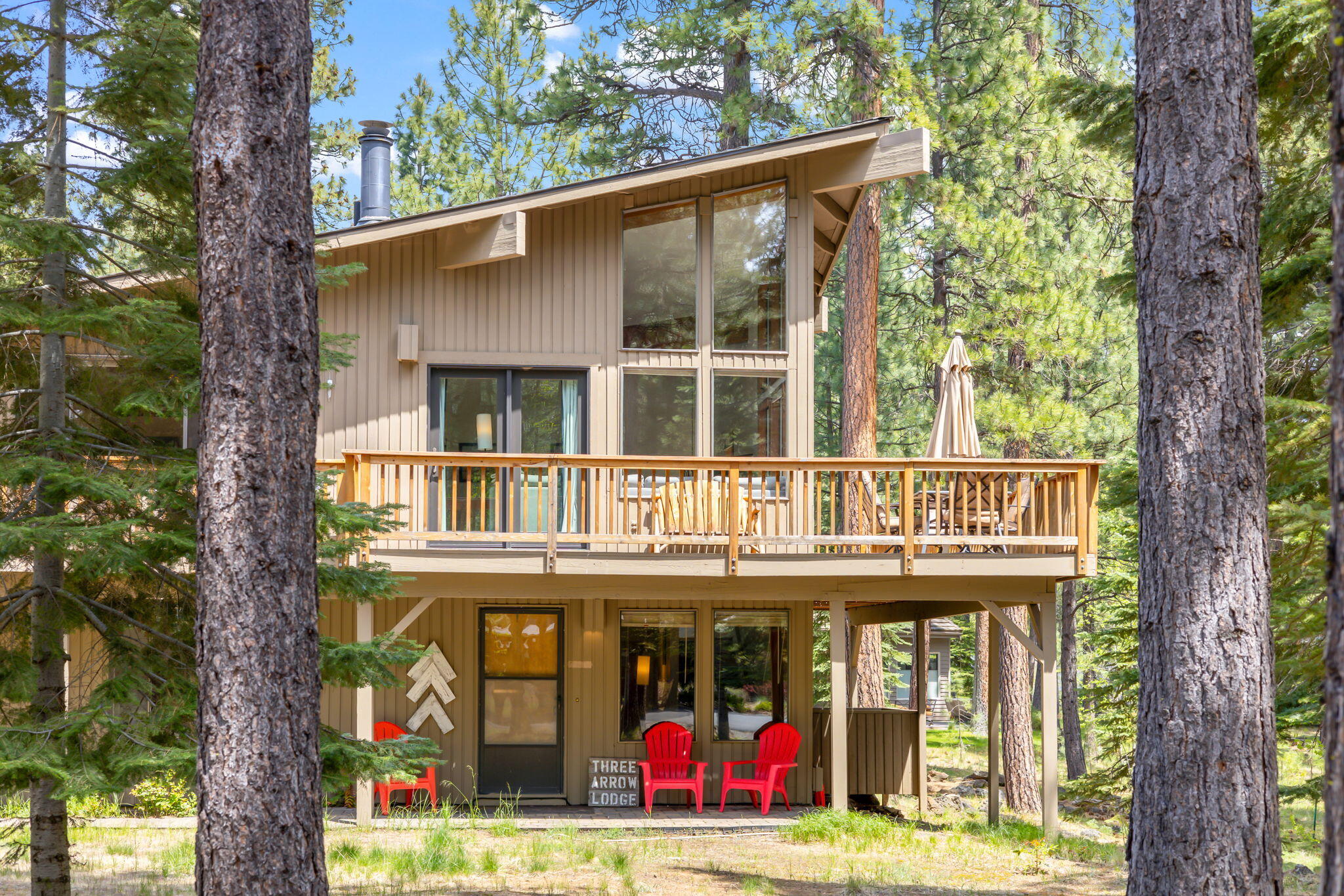 This Black Butte Ranch retreat is just a short walk from the Glaze Meadow Recreation Center, and has a strong track record as a vacation rental. This four-bedroom home with a reverse-living layout has a variety of potential uses including a full-time residence, a second getaway home, or vacation rental investment property. First level features a family room, two bedrooms, a large laundry room, and a patio for outdoor living. The second level features an open living floor plan with kitchen, eating area, a great room with vaulted ceilings and a stone wood burning fireplace as well as two additional bedrooms and a full bathroom. A large wood deck wraps around three sides of the home for upper level outdoor living. Exterior features a large paver driveway, detached two car garage with attic storage space. Updates include exterior paint, new roof in 2019 and new heat pump in 2018. All furnishings included in the sale.