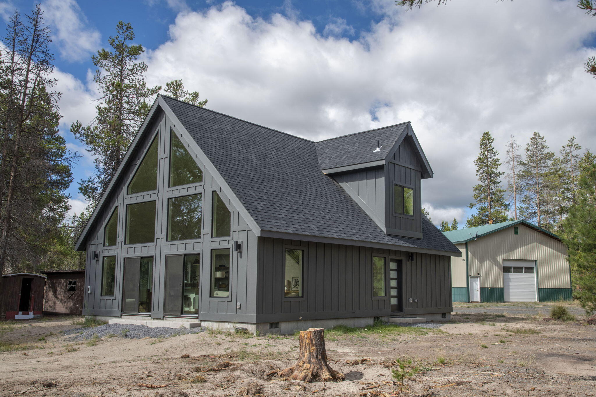 A newly completed 1,713 sq. ft. home situated on a private 3-acre parcel at the end of a cul-de-sac, adjacent to a 1,500+/- acre ranch ensuring privacy and tranquility. The property includes a 36' x 36' insulated shop with a metal roof, 12' overhead door, loft and storage area. Fabulous great room floor plan, floor-to-ceiling windows, a ductless mini-split heating/cooling system throughout, luxury vinyl plank flooring & custom metal staircase railings. The kitchen is appointed w/custom cabinetry, quartz countertops, hexagon mosaic tile backsplash, farmhouse-style sink and LG stainless appliances. The primary bedroom boasts a vaulted ceiling, walk-in closet, tiled shower, dual vanity, quartz countertops, jetted tub & sliding barn door. The level, fully fenced lot is nicely treed and includes a 10'x10' pump house. Located near La Pine State Park, Wickiup and Crane Prairie Reservoirs, Sunriver, the Cascade Lakes Highway, and an abundance of Central Oregon's recreational opportunities.