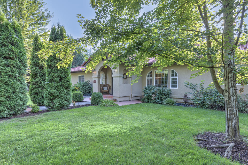 setting just outside of town on a very quiet, paved road that only residents use. pride of ownership is obvious when you walk into this 2488 sq. foot home. with beautiful hardwood floors custom cabinets in the well designed kitchen with stainless steel appliances. The open floor plan has a double sided gas fireplace that is open to the dining room and living room The very large master bedroom looks over the uniquely styled courtyard and the heated in ground pool. Out back there is a  covered pagoda, a nice water feature and a small shop for your hobbies There is plenty of room for parking with a large three car garage. There is a a large gate to access the back yard where there plenty of room to store any recreational vehicles.  This home is just minutes to Medford or Jacksonville, don't let this one get by, it will go fast