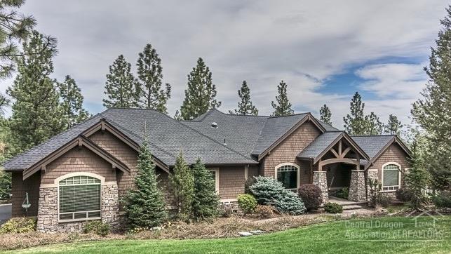 High quality home surrounded by trees above the Awbrey Glen golf course. This spacious home has crown molding details throughout, cherry floors and cabinetry, a professional kitchen, and a large main level master suite. The lower level features a large bonus room, fully wired media room, and designated wine cellar. Enjoy the quiet cup-de-sac landscaped with two ponds plus outdoor living spaces