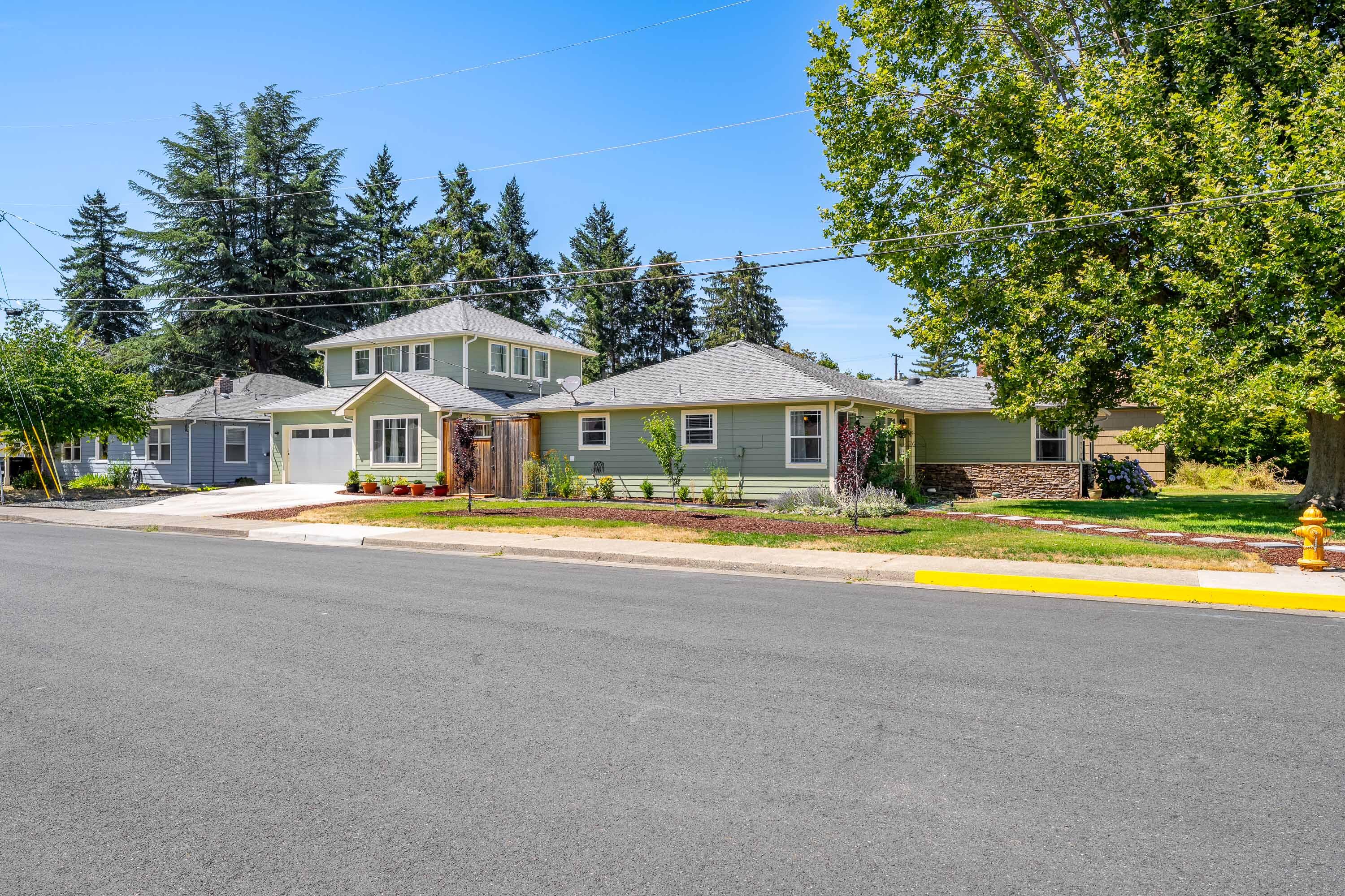 Charming, well-maintained 3 bdm, 2 ba single level home offering approximately 1,527 sf  of inviting living space. Located on a desirable corner lot with newer 1 bdm 1 ba, 2 story 631 sf ADU.  This property blends classic details with thoughtful updates. Inside, warm hardwood floors flow throughout much of the main living areas, creating a welcoming ambiance. Updated windows, central gas heat/ac, cozy fireplace with an electric insert, offers year-round comfort and aesthetic appeal. Both bathrooms feature tile tub/shower combinations, providing durability and style.  Outdoor living is equally impressive. A deck is ideal for summer gatherings, while a small covered patio offers a peaceful retreat for morning coffee, or evening relaxation. A MUST view home!