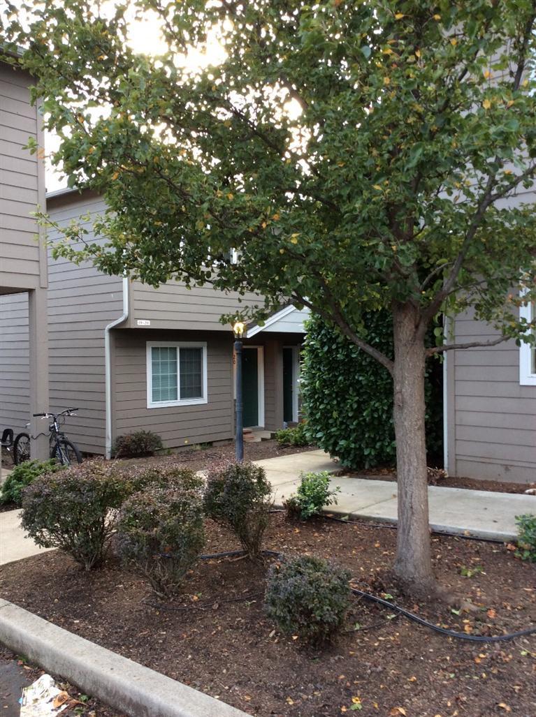 Great location - Perfect for the first time home buyer or investor. This 2 bedroom, 1 1/2 bath townhome, is an end unit, and one of only two units in a stand alone dwelling. Large bedrooms, closets, and huge upstairs laundry. Nice, private setting; covered back patio and locked storage. HOA includes water, sewer, garbage, basic cable. Unit #19, next door also available.