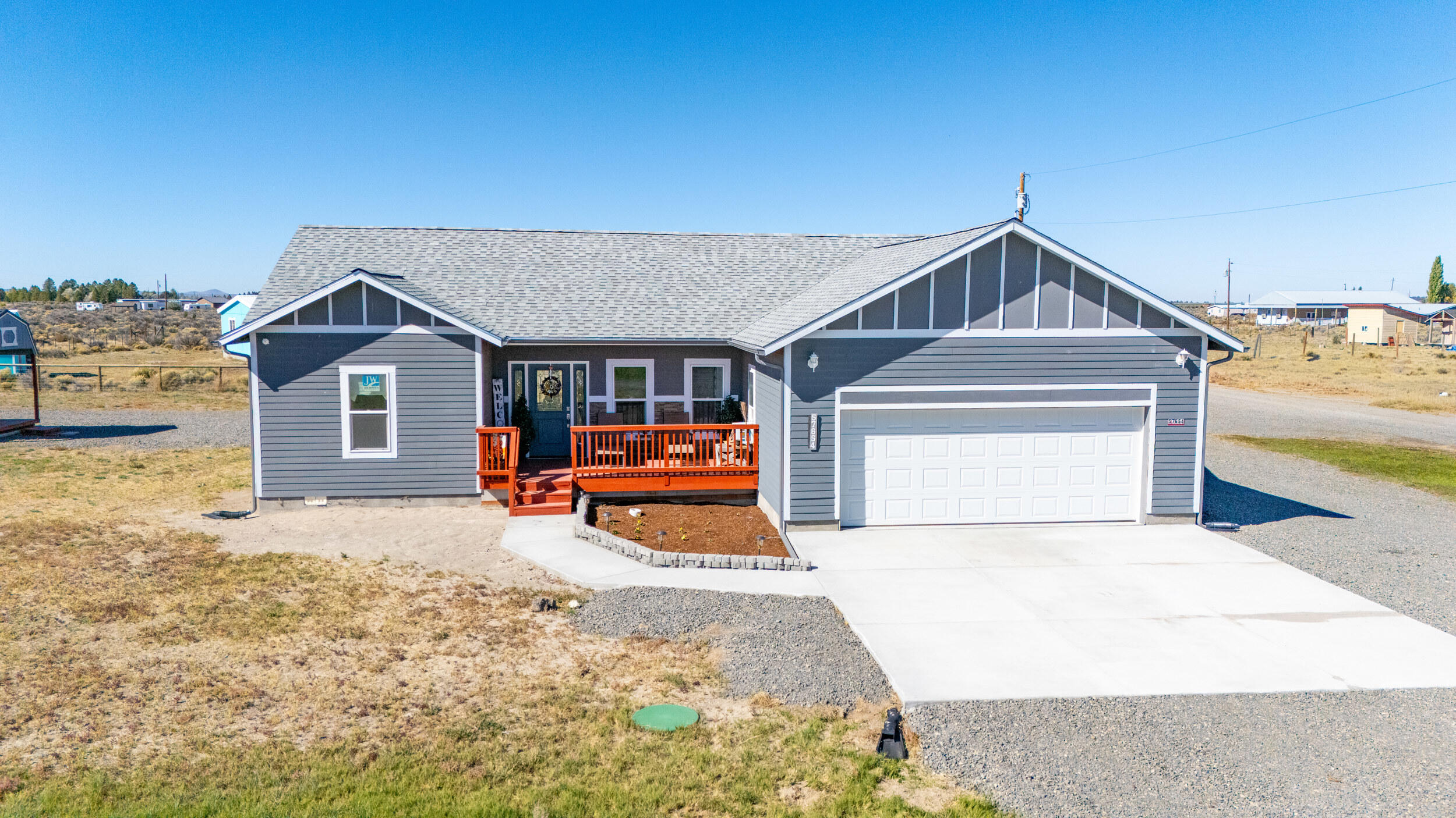 This beautiful newer home is located on a corner lot in an ideal location in Christmas Valley, just minutes from the local park, lake and golf course. The 3 bedroom 2 bath home also includes a shed, above ground pool with solar cover and an RV space with RV hookup. Inside you'll find modern finishes and 9ft ceilings with unique barn doors. The primary bedroom has a large walk-in closet with built in shelving as well as a double vanity, jacuzzi tub and tiled shower in the bathroom. New stainless steel appliances in the kitchen, vinyl plank flooring throughout, double paned vinyl windows, composition roof and an extra large 24x24 2 car garage add to the value of this home. The charming town of Christmas Valley is gaining popularity for those wanting to live affordably in Central Oregon. Definitely visit this home if you're considering a move to the area!