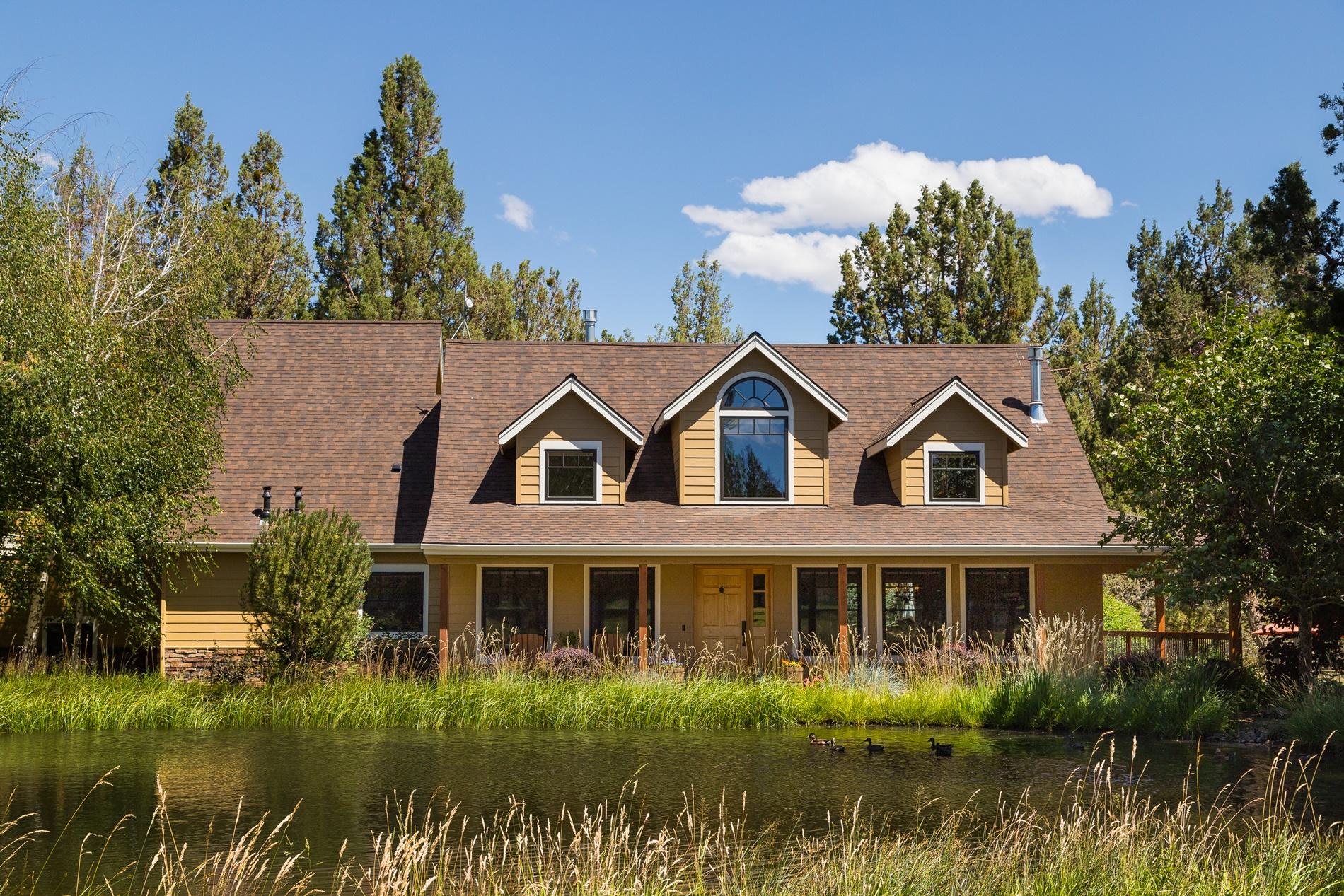 This stunning custom home lives new in a beautiful park like setting with multiple outbuildings, additional living quarters, & studio space in the desirable Tumalo community. Exquisite finishes throughout including built in speakers, hand trawled walls, wood doors, wrapped windows, and beautiful birch wood floors. The kitchen has a peaceful view to the east pond with water feature, slab granite counter tops, farm sink, 36'' Wolf oven & separate cook top. The spacious media room over the garage is not to be missed with vaulted tongue and groove cedar ceiling, surround sound entertainment system, built in bar area, & private balcony. This 6 acre property includes 5 acres of water rights covering the property through underground sprinklers & a drip system with 2 ponds. The whole property is fully fenced and cross fenced with 3 gates for vehicle access. It could easily be set up for animals with options for pasture areas. View additional pictures & information at www.GerkingMarket.com