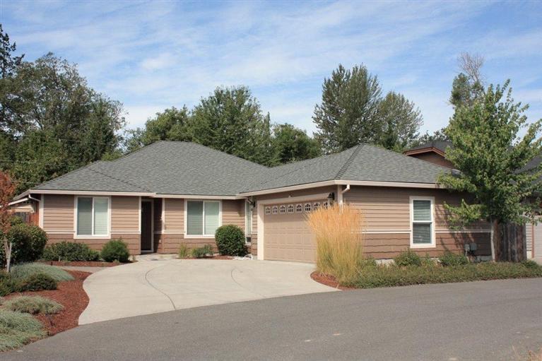 Better than new and ready to move right in! Built in 2008, this custom 1841 square foot, 4 bedroom 2 bath home is simply immaculate! The split floor plan includes living room with vaulted ceilings, corner gas fireplace, plant shelves with indirect lighting and French doors to a covered patio. Kitchen has range/oven with gas cooktop, built in microwave, dishwasher, stainless sink, open dining area and laundry room with sink and cabinets. Spacious master suite has ceiling fan, soaking tub, separate shower, double sinks, walk in closet with window and custom shelving plus three additional bedrooms and main bath. Central heat and air, custom window coverings, quality cabinetry, moldings and trim and many little extras for comfortable living! Professionally landscaped, low maintenance yard with sprinklers, drips, fenced backyard with storage shed, city services and schools. Close to shopping and medical facilities! A very special home in a great neighborhood of newer homes! Call Today!