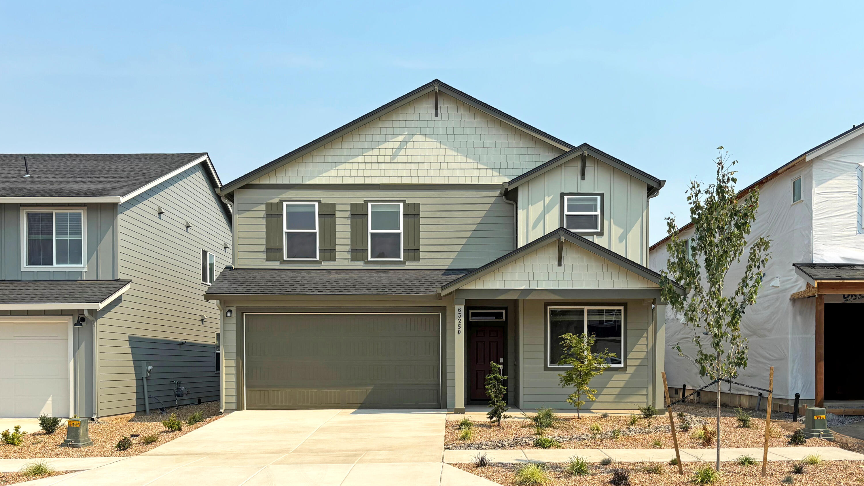 Welcome to Acadia Pointe, a new community in NE Bend. This home is the ''Jade'' floorplan. The main floor includes a full bedroom and bathroom along with an open concept kitchen and great room, creating the perfect space on the first level. Upstairs discover the large primary suite, accompanied by two oversized bedrooms and a very large bonus room/bedroom. The second level is complete with a bathroom and laundry room. Quartz countertops adorn both kitchen and baths. Front yard xeriscape landscaping with drip system and backyard fencing included. Renderings and sample photos are artist conceptions only. Photos are of similar, or model home so features and finishes may vary. Home includes Central Air, Refrigerator, Washer & Dryer, and Blinds. Taxes not yet assessed. Homesite #52