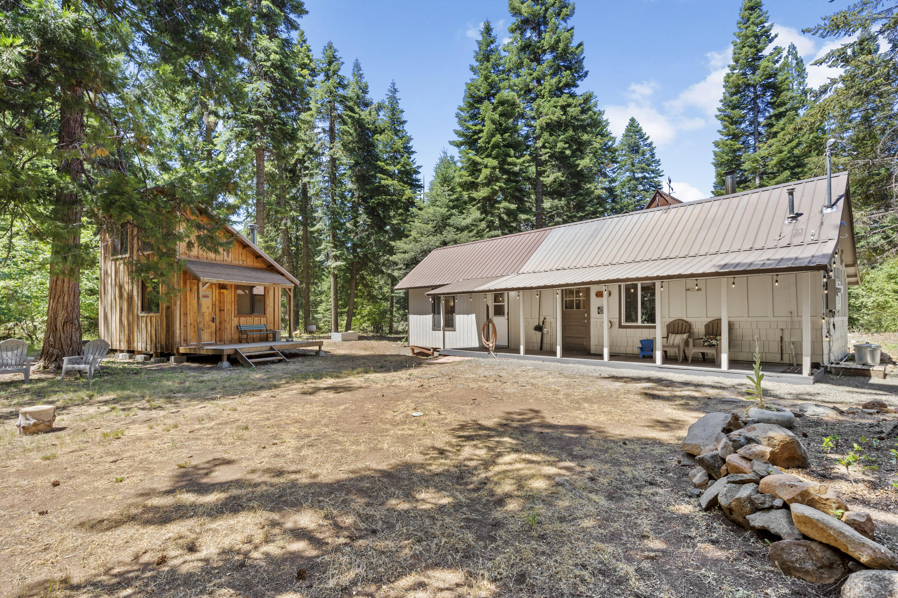 Great New Price! What an Awesome getaway! Clean air, Cool sunny days, and Crisp mornings in the Cascade Siskiyou Mountains. Close to Pacific Crest Trail, Pinehurst Elementary, Greensprings Inn and Tub Springs. Located off the highway, very quiet with tall pines, fir, wildlife and lots of wildflowers. 
Seller has installed an electric car charging outlet and upgraded many amenities, making the cabin a little showplace. You will be pleasantly surprised. Fresh Interior paint. private, comfortable and cozy cabin with an additional 221 sq.ft. structure with loft, 2nd wood stove and deck for  your art studio, work shop or office. Both wood stoves are certified, Deluxe storage shed of 102 sq.ft., propane heater in home, 7500 watt generator, good well, power and septic. Up down blinds, freshly painted, laminate floors. Great biking, hiking, cross country skiing and fishing near Hyatt and Howard Prairie Lake. Established community within 30 minute drive of Ashland