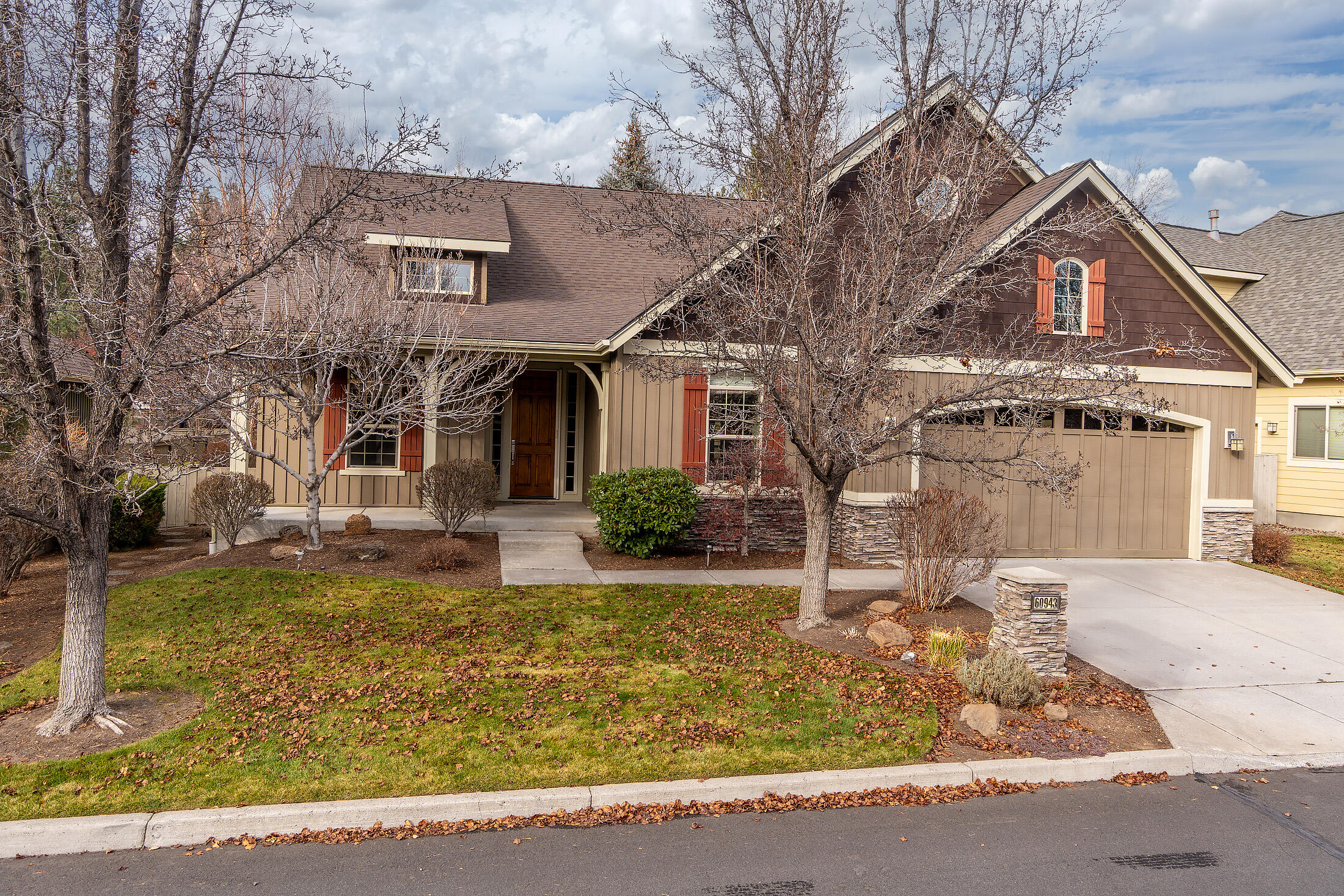 Inviting S.W. Bend single level home in desirable River Rim neighborhood. Enjoy exceptional custom quality and tasteful decor throughout. 3 Bed, 2 Bath, 1900+ sq ft home. Offers open-easy living floor plan. Dramatic vaulted and 9 ft. ceilings and windows, gas fireplace, hardwood flooring. Great room adjoins dining room. Convenient kitchen, updated appliances, tile counters, breakfast bar and pantry. Spacious vaulted primary suite, walk in large closet, soak tub and shower. 3rd bedroom has built in desk in closet. Separate utility, large storage closets, 3 car tandem bay with built in storage. Lovely landscaped yard, fenced with large back paver patio and sunny front covered porch. Close to Deschutes River trails. 40 acre common open space and community park.