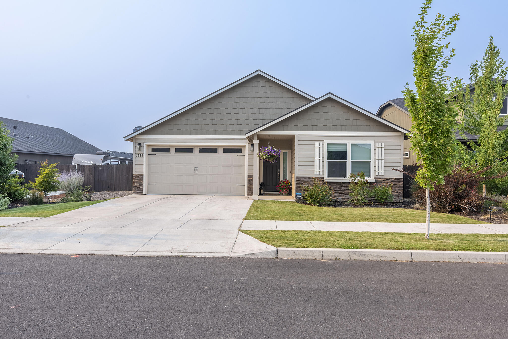 Built in 2019, this 1979 sq ft, 4-bedroom, 2-bath home offers spacious, single level living with an open concept design ideal for both everyday comfort and entertaining. Located in NW Redmond, the home features vaulted ceilings, quartz countertops, and upgraded hardwood flooring throughout the main living areas. The open-concept kitchen is as stylish as it is practical, featuring a large walk-in pantry, a breakfast bar, ample counter space, and seamless flow into the dining area and great room. The private primary suite includes dual vanities, a soaking tub, walk-in shower, and a spacious walk-in closet.Step outside to enjoy a covered back patio and fully fenced backyard perfect for relaxing or hosting guests. With a two car garage and attractive curb appeal, this home is a must see!