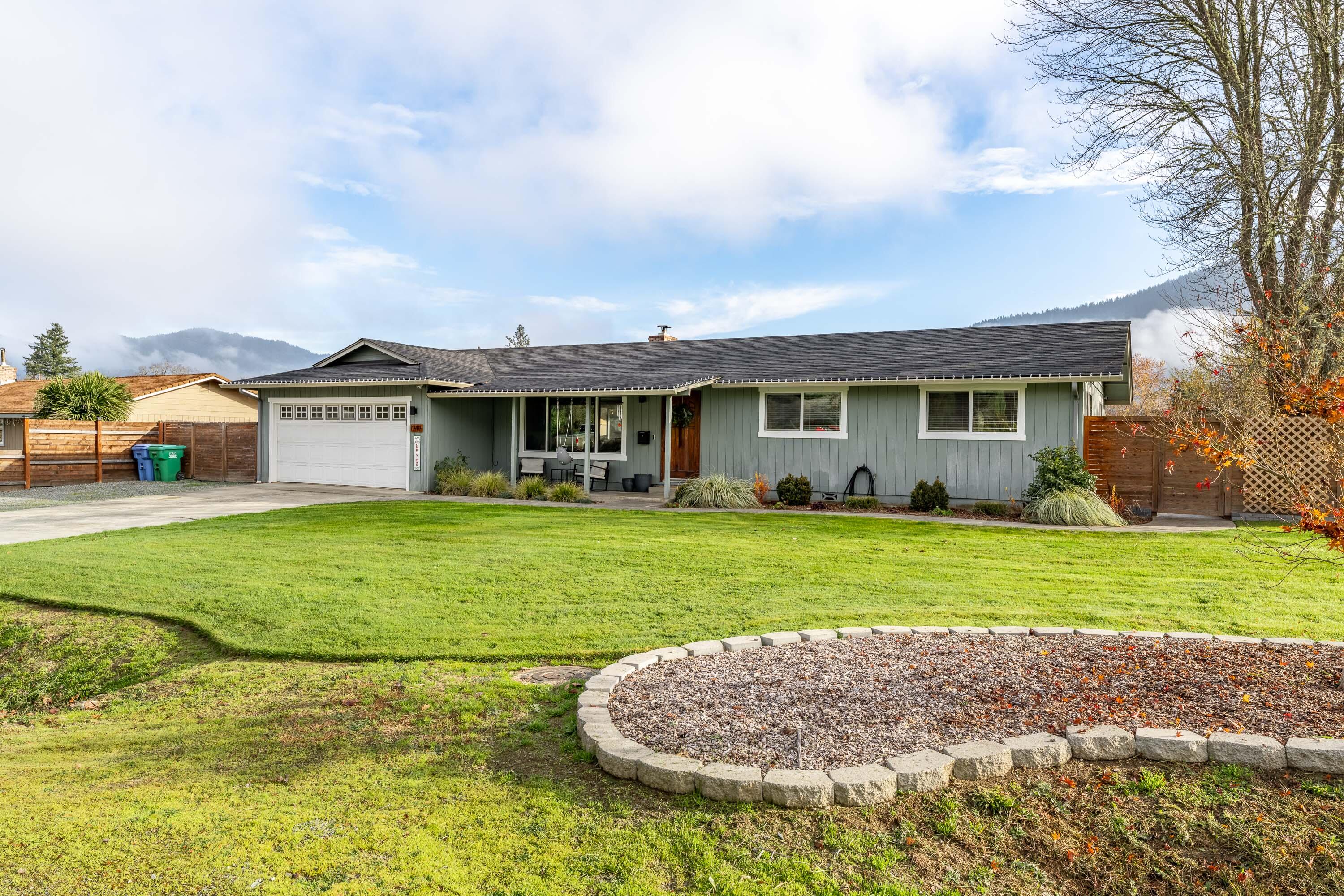 Located in South Grants Pass on a large lot in a desirable neighborhood, this well-maintained 3 bed, 2 bath home offers 1,445 SQ FT of comfortable, modern living. The spacious living area features a vaulted ceiling, LVP floors throughout, & a new wood stove. Numerous updates enhance the home, including vinyl windows, an oversized sliding glass door, LVP flooring, updated bathrooms w/ tile floors, upgraded interior doors & trim, added ceiling insulation, smart thermostat, & more. Set on a generous .25 acre lot, the property provides excellent outdoor space with RV/Boat parking, garden/planter beds with drip system, new sidewalks/patio, & front/back yard sprinklers. The backyard creates a great space for pets, gatherings, & gardening. New roof done in 2020. Move-in ready and thoughtfully upgraded, this home offers both comfort and convenience in a great neighborhood. Just 5 minutes to Downtown Grants Pass, Three Rivers Hospital, the Rogue River, and several shopping outlets.