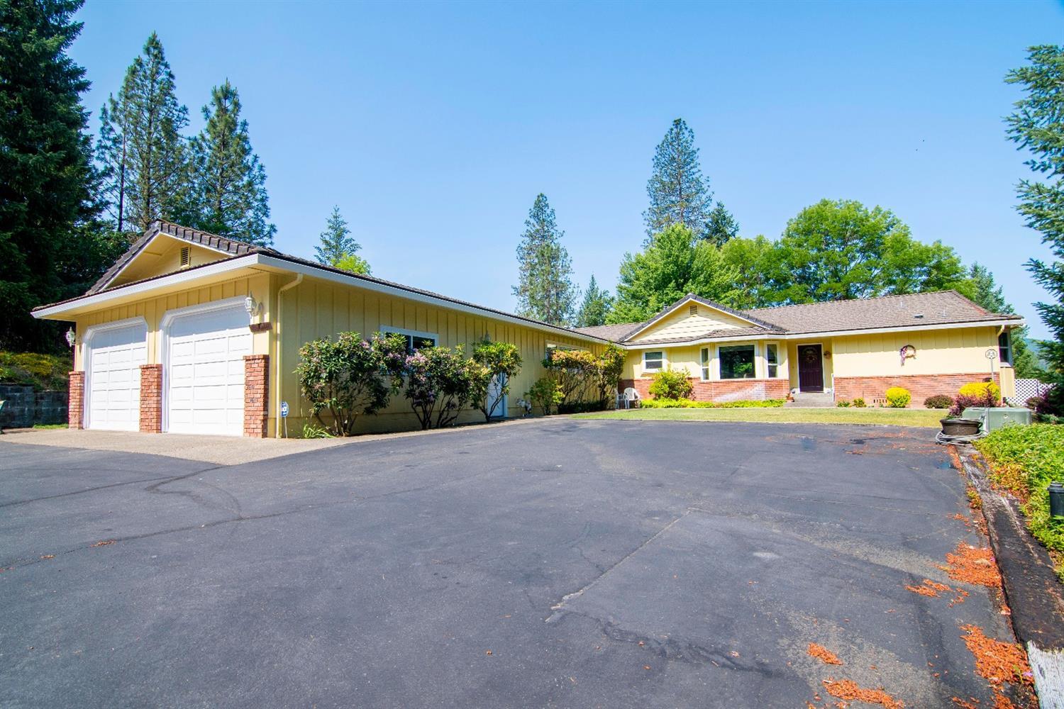 Wonderful Country Setting on 5+ acres! Gated entry leads into a large paved partly secluded landing with a beautiful home and shop. Built in 1990 this well-maintained home has recently been updated. The home features 3 bedrooms, 2 baths, approx. 3038 sqft., living room w/tongue & groove vaulted ceiling, fan and pellet stove, Split floor plan w/hardwood, tile, carpet & vinyl floors and large family room. The nice country kitchen comes w/double sink, granite counters, wood floors, stainless steel R/O, Frig, DW and breakfast bar. Large master w/walk-in closet, master bath w/double sinks & separate shower and jetted tub. Laundry room w/sink, cabinets, draws, binds & includes, washer/dryer. Home has HEPA! Beautiful outdoor living space in back w/tongue & groove vaulted ceiling w/fan over the trek deck also includes nice hot tub. Fenced backyard w/mountain views. Oversized attached 2 car garage w/cabinets, backup generator and Large detached garage/shop, RV parking and privacy!