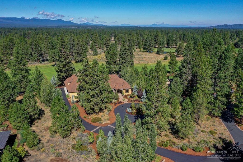 Luxury Tuscan home in Sunset View Estates on the 4th fairway of Lost Tracks Golf Course. SINGLE LEVEL living with a bonus room and bath upstairs. Stunning kitchen with granite &amp; mahogany counter tops, walnut floors, Dacor range with double ovens /6 burner stove top. Dining and sitting area off the kitchen with a fireplace. Formal Dining room with a bar/butler's pantry. Living room and den/office with box beam ceilings. All bedrooms are suites with private bathrooms. Master bedroom has door to patio, fireplace and view of the golf course. Master bathroom with tiled shower, copper soaking tub, dual vanities, travertine floors and counter tops. Bonus room upstairs with room for pool table and sitting area. There is a 550 SF media room with screen, projector, speakers, multi-level seating &amp; beautiful woodwork. Covered paver patio has a fireplace and exhaust hood for BBQ. 3 car garage plus a golf cart bay w/built-in cabinets and epoxy floor. 1.2 acre lot with circular drive-way.