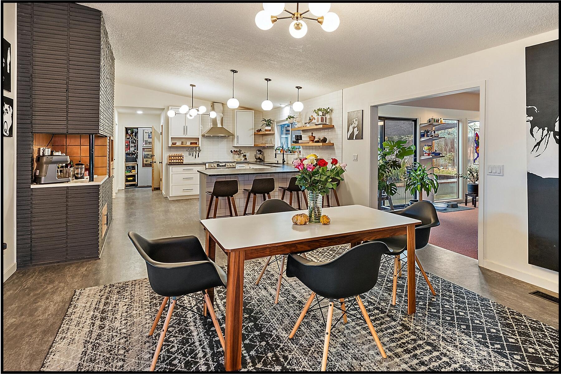 Magical Mid Century Modern Home. Convenient & peaceful location in desirable Blossom Hill Terrace. Open, spacious, light, bright, & thoughtfully updated, this wonderful home will energize your soul. Clean lines, sleek angles, futuristic yet simple forms make up the 1,934' main living areas, plus there is an additional 1,111' = 3,045' total under roof/enclosed spaces. Amazing vaulted custom kitchen & dining area w/coffee bar, walk-in butler's pantry, breakfast bar, gas range/oven, includes refrigerator, & open sunroom access, sep. living & family rooms w/classic fireplace/woodstove, 3 bdrms/3 full classic baths, & that includes the private primary suite. Permitted garage conversion, now an office/studio or convert back if needed, lrg. storage/utility rm. plus additional office/den/hobby or workout room. Wonderful private backyard, w/delightful koi pond, deck/area for hot tub, putting green, & more. This is a special classic home, a unique form of art that will inspire & warm your heart