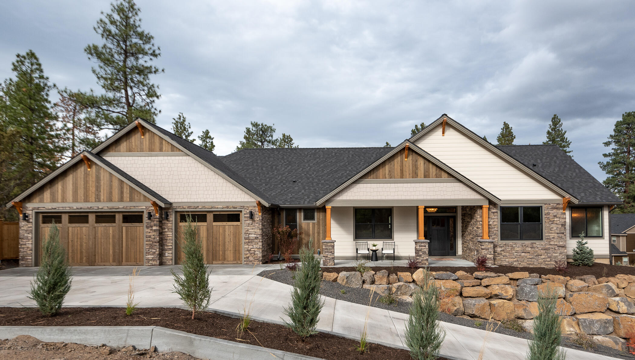 THIS BRAND NEW, sunny 3146sf HOME on South-facing .35acre lot offers FOUR ensuite bedrooms (master plus three), four full baths and one half - all on ONE LEVEL. The gorgeous, upscale kitchen is open to a vaulted great room with floor to ceiling stone fireplace with built-in bookshelves to each side. Easy white oak flooring in the common spaces, large ensuite  bedrooms + absolutely stunning baths. Kitchen has two full-sized work spaces; two sinks, ovens and dishwasher.  Appliances are all Bosch/black stainless.  Upgraded lighting in and out, expansive decking and covered porch off off the great room. Long flat spot at the base of the  backyard could be great RV parking or shop space. Oversized/Xtra-deep 3car/attached/finished garage is sheet rocked/textured/painted/trim, w/epoxy floor, hot & cold water, and fold-down steps to finished attic over garage.