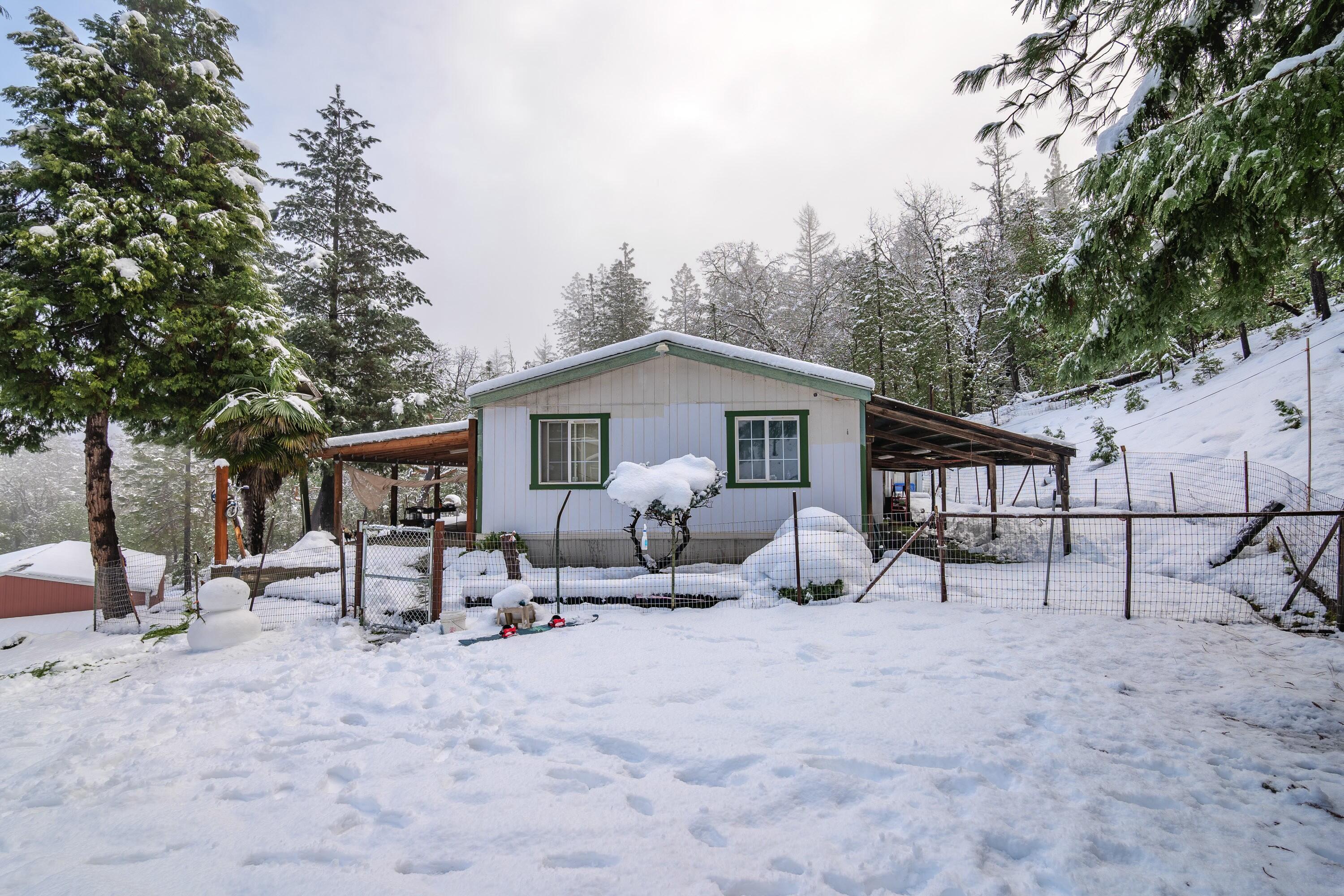 Welcome to 10511 Lower River Rd! This 1248sqft, 3 bed, 2 bath, 1994 manufactured home sits on 4.85 acres backed by BLM! Exterior features include large covered patio, 3 bay carport/hay storage, 1440sqft metal shop & more! Potential 2 family set-up with neighboring property for sale. A little TLC will make this place shine again!
