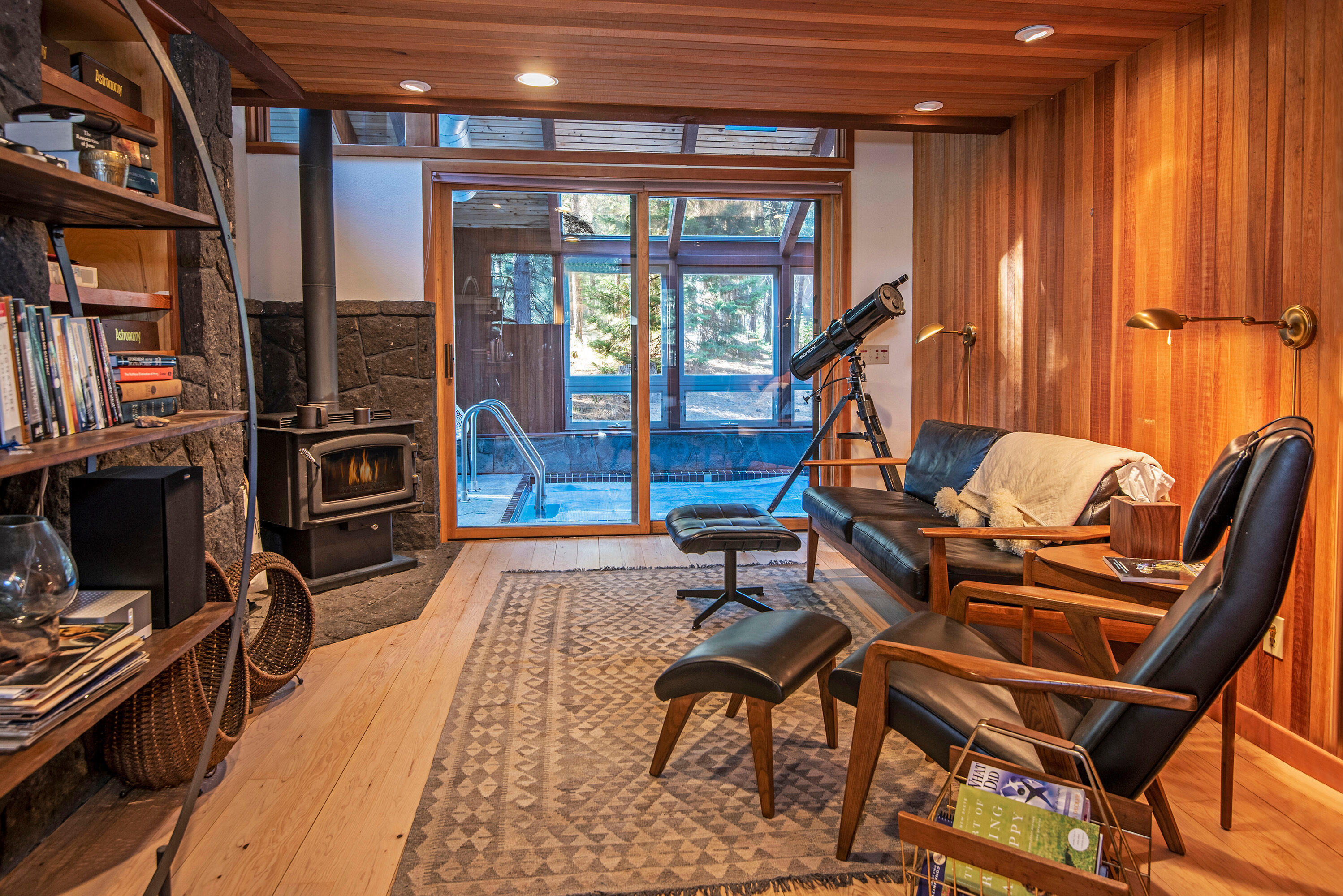 A Beautiful architect built Smart home with lots of floor to ceiling windows to bring in the natural light all year long. Walk out to the wrap around deck with views of the golf course, 15th hole, expansive par five. Take a swim in the solar heated lap pool inside the home year round. Enjoy your new smart jacuzzi (WiFi mobile app control) under the stars! Large chef's kitchen with Wolf stove, double oven and smart touch screen refrigerator  to order your groceries from, see inside the fridge, play music and watch videos. Grand Lava stone fireplaces throughout home. This tranquil home offers all this and so much more!