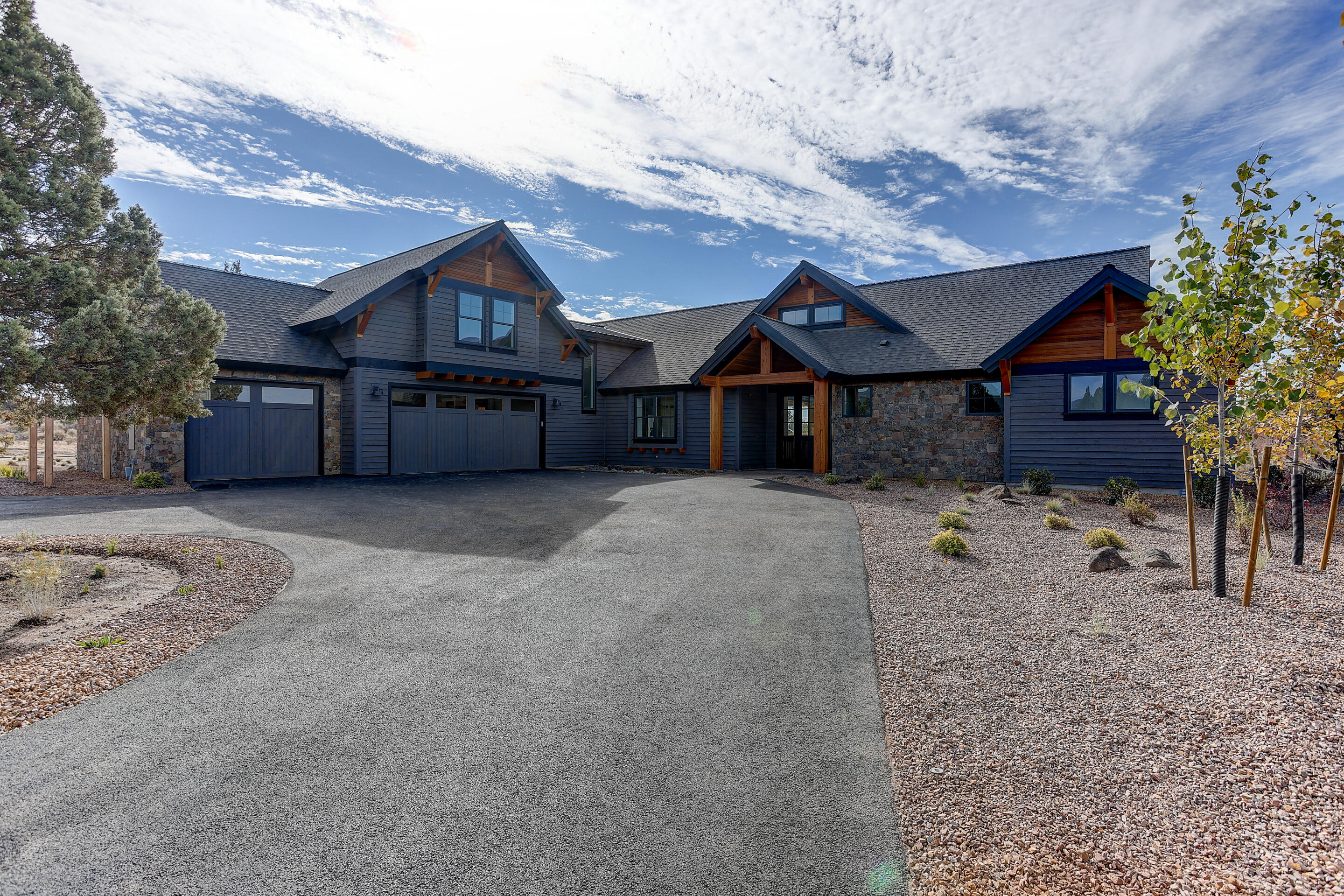 New construction on XL lot (2 tax lots) just completed end of October. 3,080 sq. ft. home w/ covered entryway opening to great room w/ exposed beam vaulted ceiling & floor-to-ceiling stone fireplace. Single-level living w/ primary bdrm on main featuring vaulted ceiling w/fan, walk-in closet w/ built-ins, double vanity & tiled shower. Entertain in your gourmet kitchen touting gas cooktop w/ hood, Alder cabinetry & oversized quartz slab island w/ brkfst bar. Two guest suites separated from primary, each w/ full bath. And a den/flex room provides more options. Watch the sunset from dining room just off kitchen & great room in open floorplan. Enjoy your backyard under the covered terrace or backyard fire pit. Upstairs discover a spacious bonus room w/ full bath revealing mtn views. Enhancements include, hand-troweled walls, hand-scraped engineered wood floors & Earth Advantage certified. Enjoy amenities of Brasada Ranch resort living w/in a 30 minute drive to Bend, Redmond & Prineville
