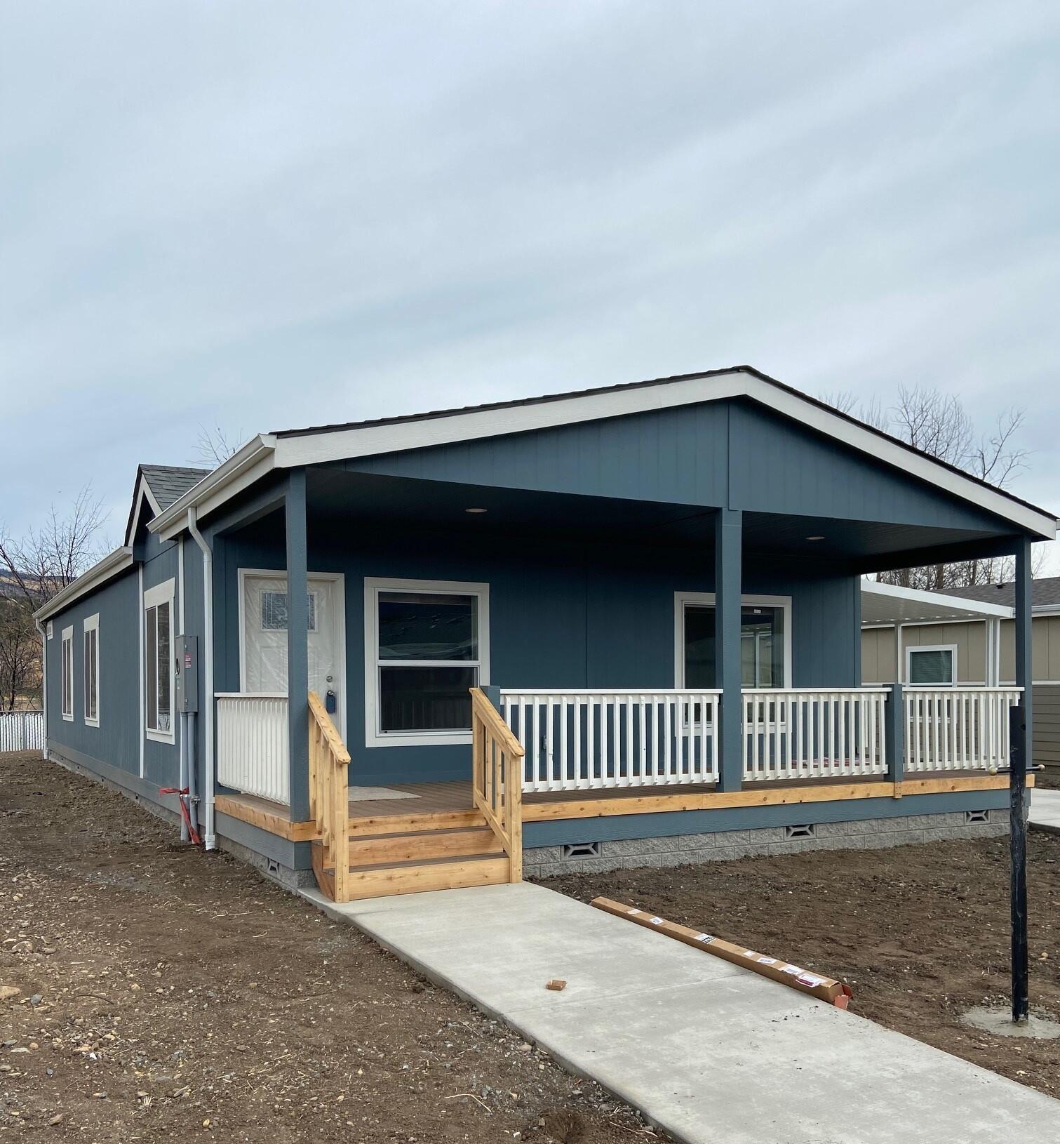 Good news!  This home has been delivered.  Normal assembly is approx.. 6 weeks.   Call on timelines & availability. Gorgeous NEW Manufactured Home in Creekside Estates 55+ Park. This Fleetwood home has 3 bdrm, 2 baths, 1500 sq. ft with 9' boxed ceilings, white cabinets, all Stainless-Steel appliances & tons of cabinet/storage space. You will love the tasteful & open design. The utility room is spacious with shelving and floor to ceiling cabinets. The bedrooms are generous with a primary bedroom that has a walk-in closet, double sinks in bathroom, lovely shower with seating and 2 closets. Each unit has an attached carport with a storage shed at the end. Enjoy the new Clubhouse with huge reception room, totally inclusive kitchen, fitness center, pool & so much more! Space rent is $650.00 and includes garbage & sewer. Enjoy the picturesque views of the mountains.