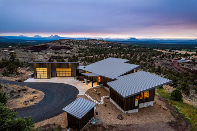 Incredible Builder/Owner designed modern, forever home! Thoughtfully placed on the lot to take advantage of nearly every C.O View.  Sunrises over Smith Rock, charming valley views, & Sunsets over the Cascades, you'll never get tired of the scenery. 4000sf home designed to make every room comfortable & usable w/ high-end finishes throughout. Main floor: large Master Bedroom & Bath, walk in closets, open shower & sunken tub Great room concept, formal dining, large kitchen w/ generous counter space, office w/ Murphy bed, bath, laundry & mud room. Attached garage & Shop/RV bay + detached toy garage. Downstairs: 2 bedrooms, bath, Family Room & flex space for game room or home gym. Multiple decks & patios to enjoy the outdoors anytime. Natural landscaping for easy maintenance. 10ac lot has protected View corridor & room for lrg Shop on lower lot. Driveway to be paved (please inquire) Great Private location, no congestion but close to RDM airport & 30 min to Bend.