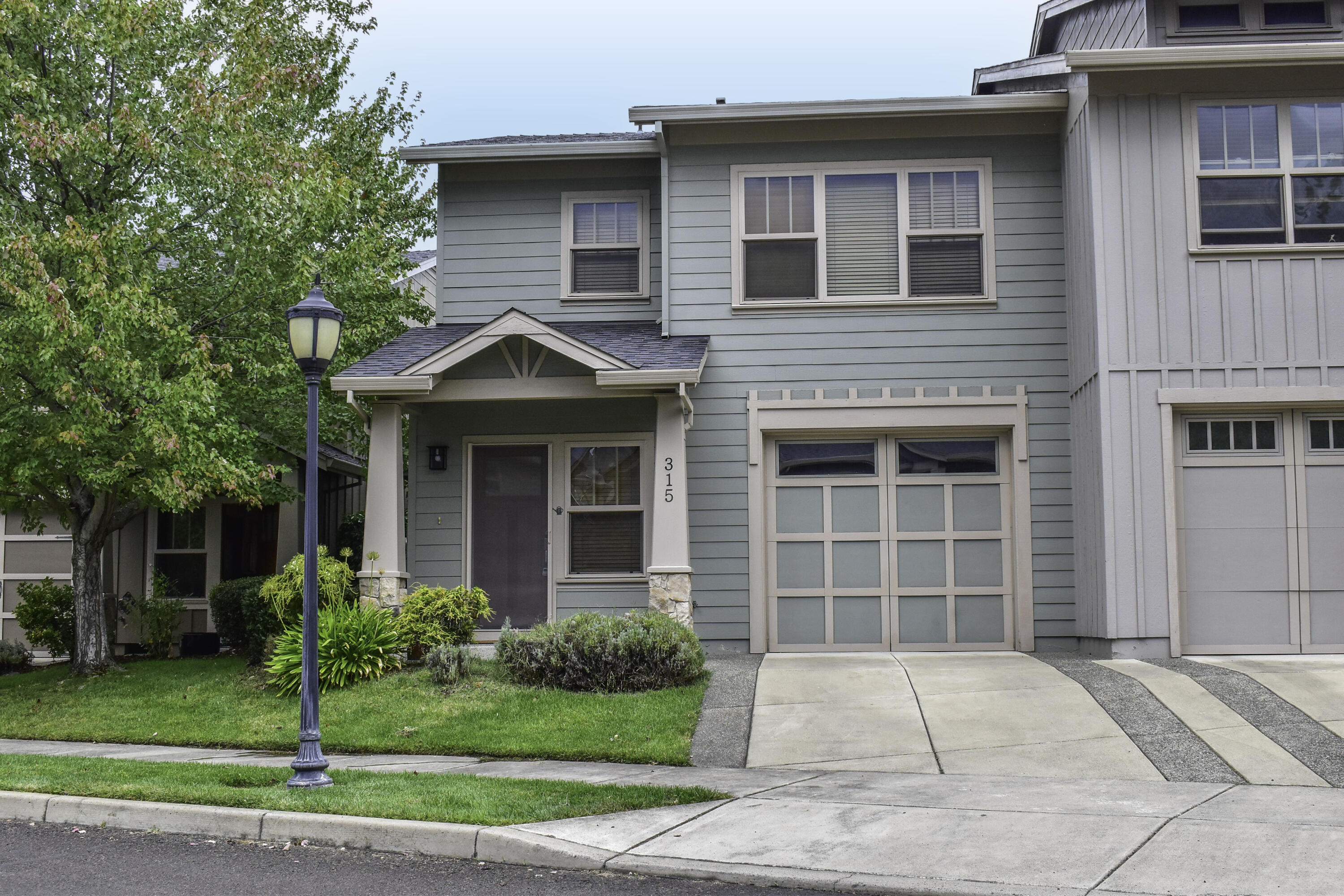 Elegant with contemporary touches, this move in ready townhouse has real wood entry,  3 bedrooms/2 baths, 1717sf of comfort built 2005. End-unit offers tons of storage, real wood blinds, finished longer single car garage, Pool/Gym/Tennis facilities access, a covered back patio AND gated direct access to the grassy courtyard! Downstairs has open concept kitchen/living area, stainless appliances, longer high-top eating bar,  granite counters, pantry storage, nice half-bath , & the finished single car garage.  Primary bedroom is upstairs, has plenty of room for King-sized bed, has 2 built-out closets, attached bath with double vanities, low step shower, & more storage! Both guest bedrooms are roomy & have built-out closets with high/low bars & shelves. The  full guest bath has tub/shower combo. Laundry area is upstairs. The complex offers In ground pool, tennis courts, gym, club house, and event-kitchen, all exclusively available to the residents. HOA is $248/mo. Rents average $2000/mo.