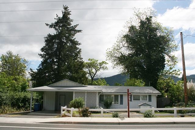 Very nice 2 bedroom, 2 bath home, plus den/office, living room with large picture window, family/dining room combo with pass through to kitchen. There is room to expand the kitchen, indoor laundry and nice storage pantry. Some updates have been done in 2014, such as vinyl windows, new insulation in the attic, 2nd bath added & new water heater. Exterior features a nice carport, large, fenced back yard, 2 sheds and patio. Home is on city water & sewer, but has a well for irrigation. Still room to make it your own! Don't miss this gem!