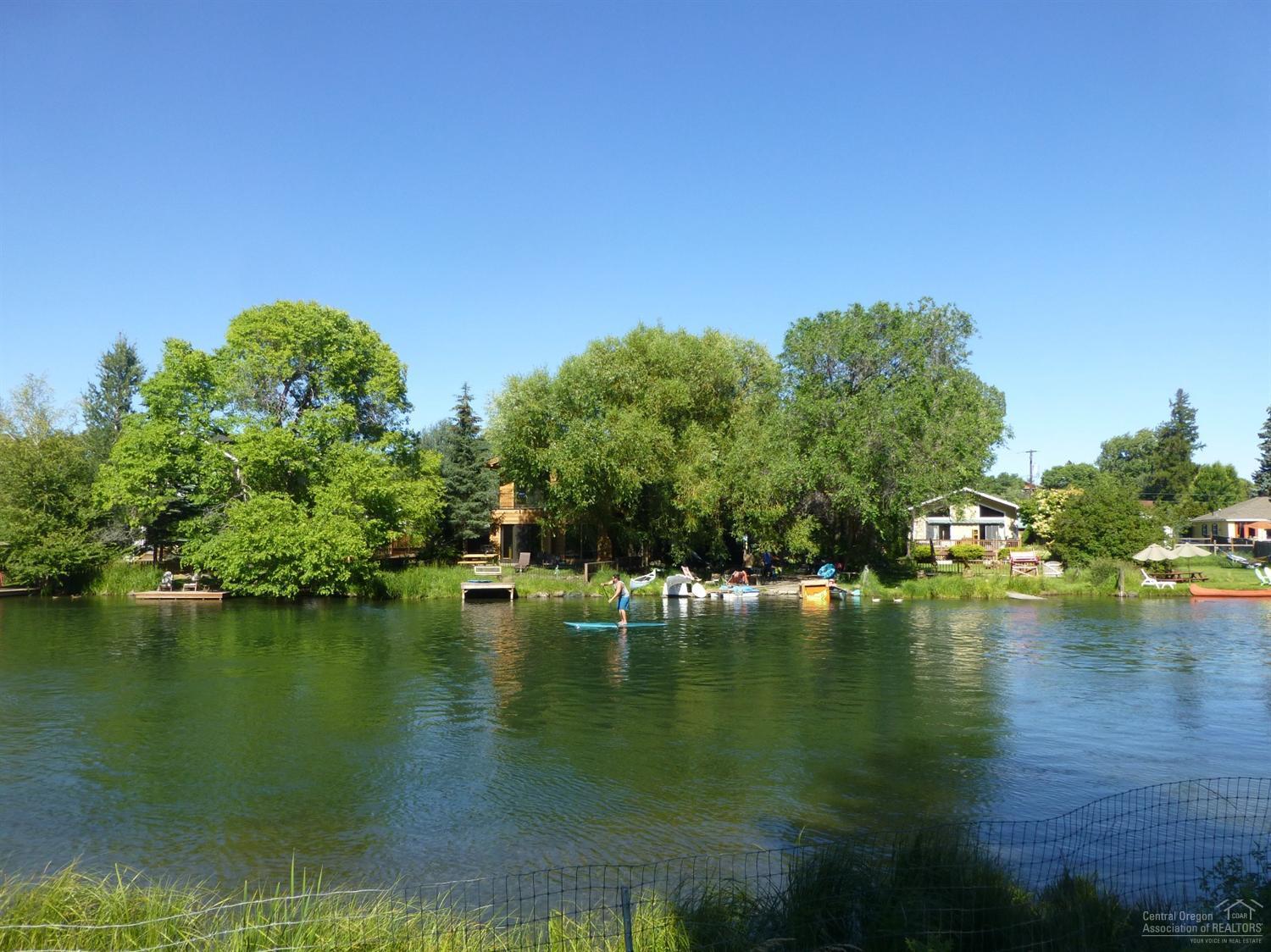 Million dollar location, million dollar lot, two cozy shacks included! This is a rare find on the Deschutes River directly across from Columbia Park,one block to the new Water Park in front of Miller's Landing and minutes from Drake Park and Mirror Pond. Bring imagination and vision to this classic Bend Riverfront property.