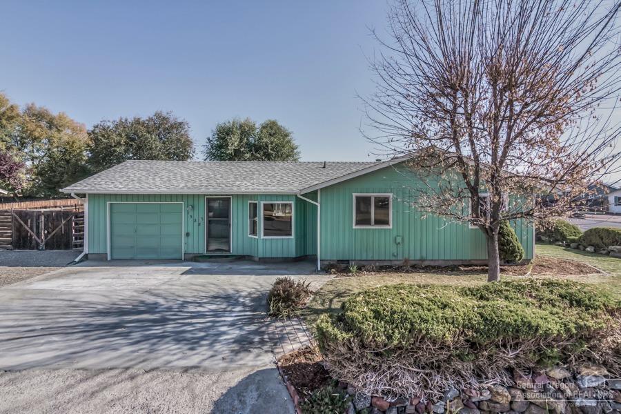 Fantastic single level family home in desirable NE neighborhood. Quick to everywhere you need to be! Super spacious 10,000 sf corner lot, artistically landscaped including large established garden area w/deer fence beautiful paver patios, decks, flowers, fruit trees and more. New interior/exterior paint, updated siding, some new flooring, new closet doors and lighting throughout. All appliances including W/D and fridge included in the sale. Could easily add 2nd bath. Home has been reconditioned inside and out. This is a great value, so don't wait to visit this turn-key family home or fantastic rental property!