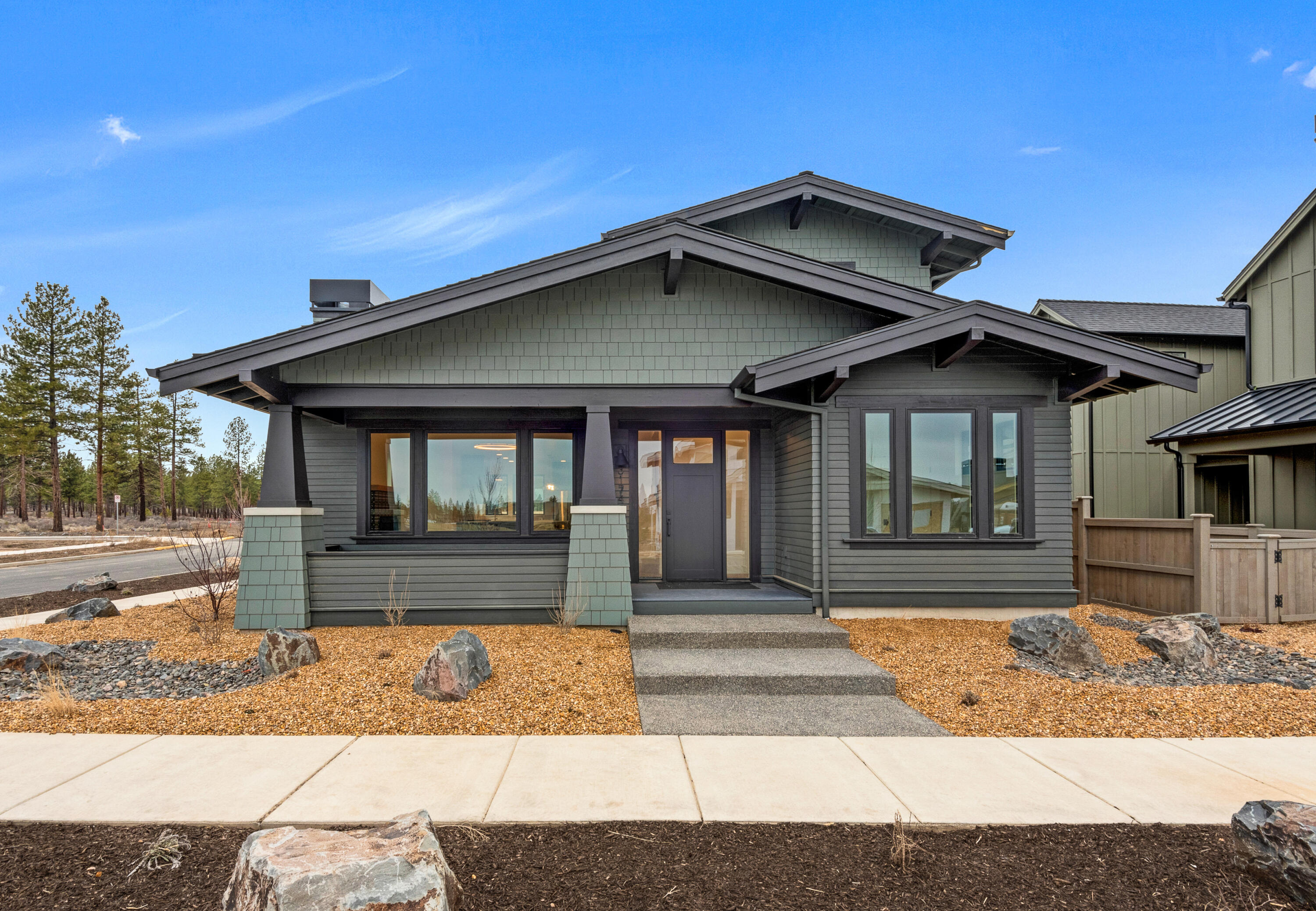 Stunning Discovery West home built by award winning collaboration of Ollin Construction & Jason Todd Designs. Covered front porch leads to entry/great room engulfed in natural light. Kitchen features exquisite appliance package, slab quartz counters and custom built-in cabinetry with soft-close doors and drawers. Main level resident suite with curbless walk-in shower, radiant heated bathroom floors and walk-in closet. Main level also features an office/study that could serve dual purpose as a guest space. Upstairs includes two guest bedrooms, full bathroom and loft area. Discovery West, situated on 245 acres on Bend's westside, is the newest community by the developers behind the award-winning NorthWest Crossing neighborhood. The neighborhood will offer a variety of home types and sizes, as well a community plaza and 40 acres of parks, trails and open land.