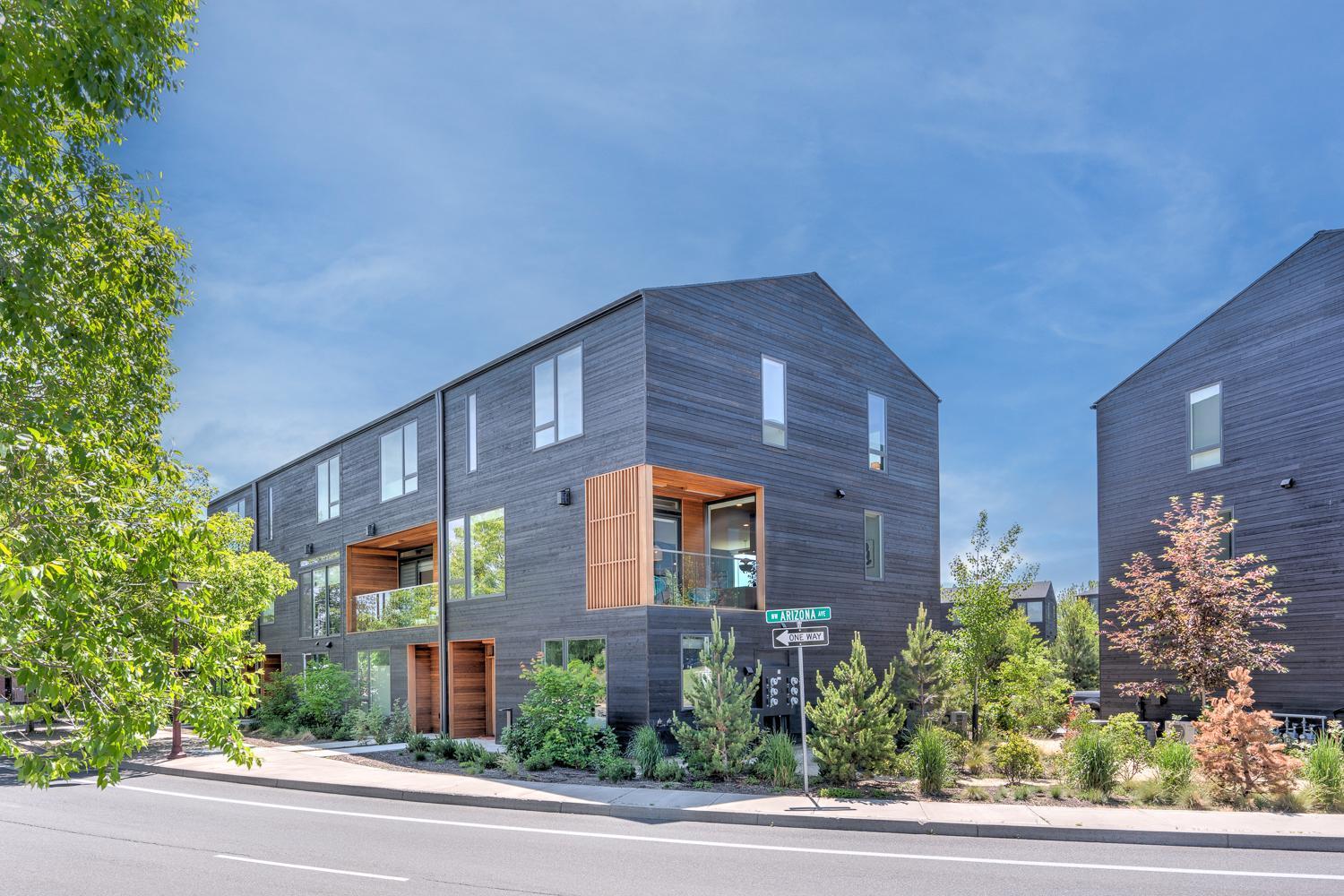 Welcome home to the Basecamp townhomes. This Earth Advantage, luxury living end unit with mountain views is located in the heart of the city.  With its contemporary design and high-end finishes you will experience the ultimate living experience.  The unit has 2 living spaces including the 3 story 3 bedroom 2.5 bathroom townhome plus the accessory dwelling unit located on the ground floor with a separate entrance, kitchenette, and private bathroom.  The primary unit is flooded with natural light, a gourmet kitchen, Sonos surround sound speakers, a private balcony to enjoy with friends and an E-car charger plug.  The upper floor has the master bedroom with luxury bathroom finishes, a walk-in closet, 2 additional bedrooms, and a small sitting area.  This property is in a highly sought-after location just steps to the Old Mill, Box Factory, Downtown shops, Deschutes River & River Trail, and restaurants. Grab a chair and enjoy a concert or 2 across the street at the amphitheater.