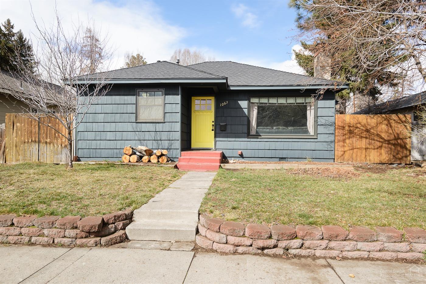 Classic Bend Cottage. This adorable home has been well maintained and updated over the years while maintaining it's original charm with Oak hardwood flooring, coved ceilings, arched doorways, and period light fixtures. Just blocks from Downtown, Harmon Park, Galveston Corridor, Newport Market and the Deschutes River, you couldn't ask for a better location. This home is situated on a spacious lot in a way that provides plenty of room to build an ADU or keep it as a large fully fenced back yard.