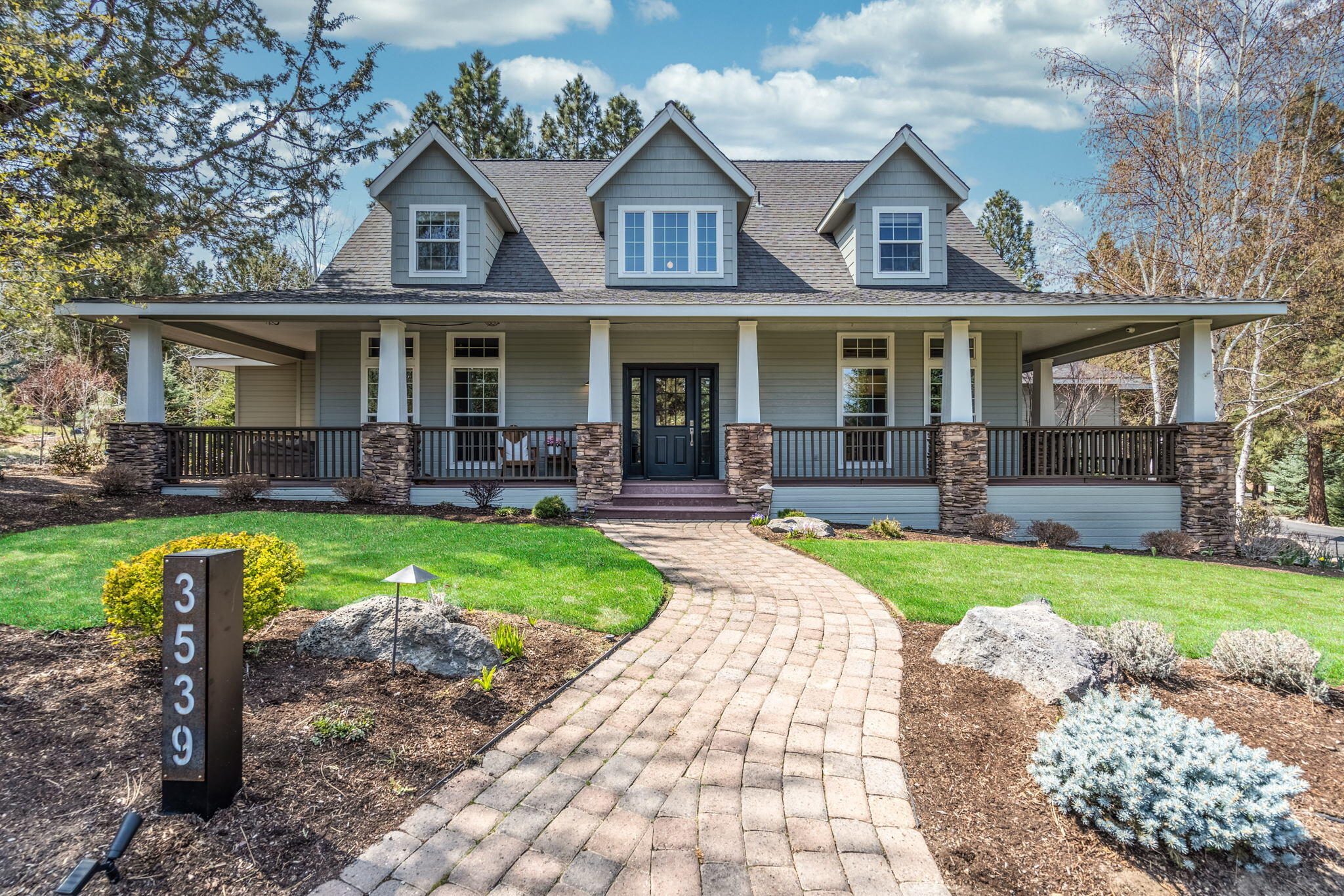 Located on a charming, peaceful street in the sought-after community of Awbrey Glen, this elegant home offers exceptional design throughout and embraces Westside living. Outstanding curb appeal features a .41/acre park-like setting and welcoming wrap-around front porch. Great Rm w/stunning, custom-designed stacked stone fireplace, expansive concrete hearth and European white oak hardwood, offers direct access to back deck, creating an ideal space for entertaining and gathering. Cook's Kitchen w/solid surface countertops, SS appl, and separate bar, opens to the Great Rm + delightful sitting rm and Formal Dining Rm. Spacious MAIN LEVEL Primary Suite features hw floors, luxurious BA w/Quartz vanities, spa-like shower w/sleek finishes, and radiant flooring. Private Home Office conveniently located w/in Primary Ste. Upstairs:2 oversized BR and full BA. 4th BR/Bonus Rm + full BA w/separate back staircase located above garage. Moments to tennis, golf, walking paths and all Westside amenities.