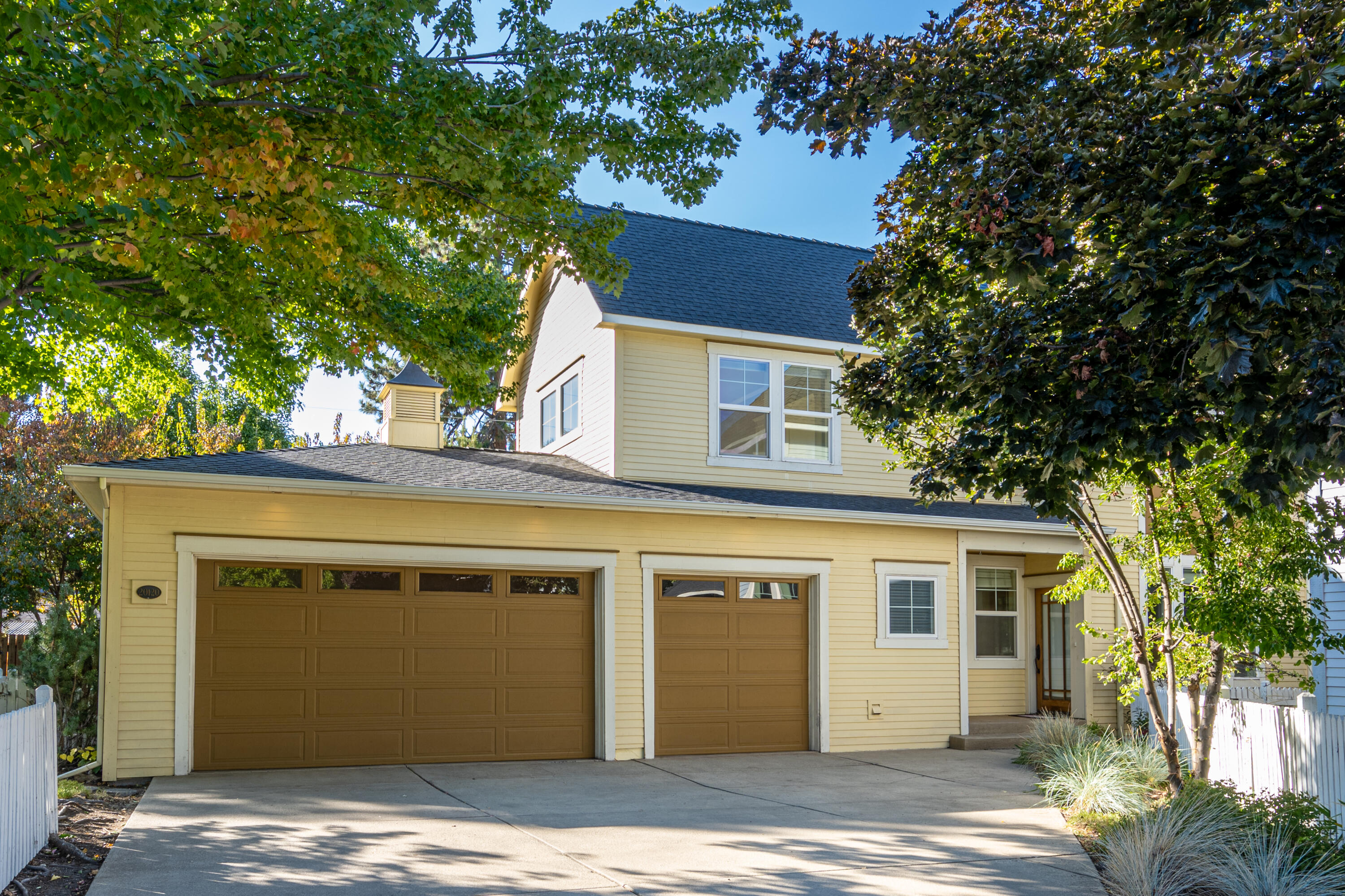 Beautiful Rozewski-designed home on a quiet cul-de-sac in the desirable SW Cloud 9 Estates and only a mile to the Old Mill District and River Trails. High quality craftsmanship and finishes throughout including built-ins, wainscoting, crown molding, and solid hardwood floors. Great room w/ gas fireplace, primary bedroom on the main floor, plus a large bonus room/loft/office and newer carpet. Enjoy the main level primary w/ fireplace that opens to a patio, bath w/ dual sinks, walk-in closet. Central vac, A/C, oversized 3 car garage, private fenced and landscaped yard w/ sprinklers. Cascade views from second floor and mature landscaping top off the charm of this roomy home off a quiet dead-end street.