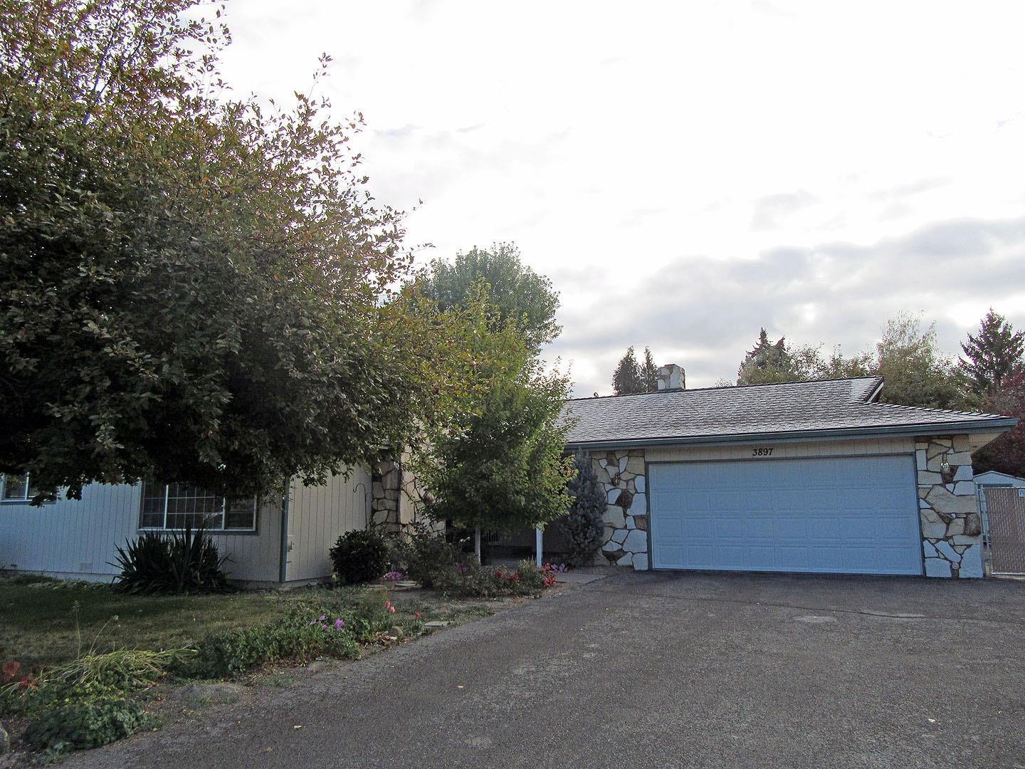 Lovely 3 bedroom 2 bath home solidly built in 1975, featuring many upgrades, including new exterior paint, vinyl windows, new cyclone fencing. Large sunken living room with gas fireplace, plus large Family room with wood fireplace and a spacious utility/craft/sewing room. Gas F/A furnace plus A/C. Located on a corner lot, with in- sprinklers, covered patio, RV parking, 10x12 storage shed, 2 car garage with great built in storage, work bench and cabinets.