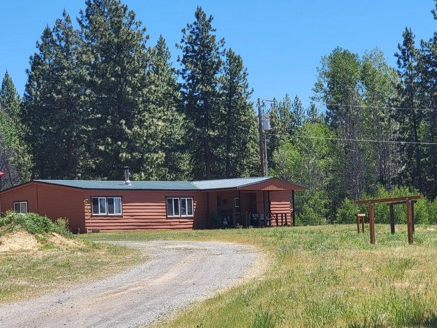 Unique Opportunity! Updated 3 bedroom 2 bath 1980 MH on almost 200 acres!  This home features, Cafe matching appliances, Cedar Lined interior walls, Complete new kitchen including Maple easy release CAbintes, Cherry Counter Tops,  Laminate Flooring, Custom Shades.  3 yr old Metal Roof, Covered Front and rear deck,  Ceritfied Wood stove,  The master bedroom has a walk in closet including a Safe Step Bath. Large insulated and heated shop, 1700 Sq Ft  with 220+ power, plumbing with a sink, currently used as a wood shop.  4 car carport or hay storage, Riding Arena, Lighted entry.  Borders Winema National Forest. This property comes with a seasonal Teepee Campground that has horse corrals. Plenty of riding trails, Lots of possiblility for having your own home and business! Currently registered with Booking., Hipcamp & Air B&B. Buisness Name is available with this sale.  When it is at full capacity, the property is a good income from the campground
