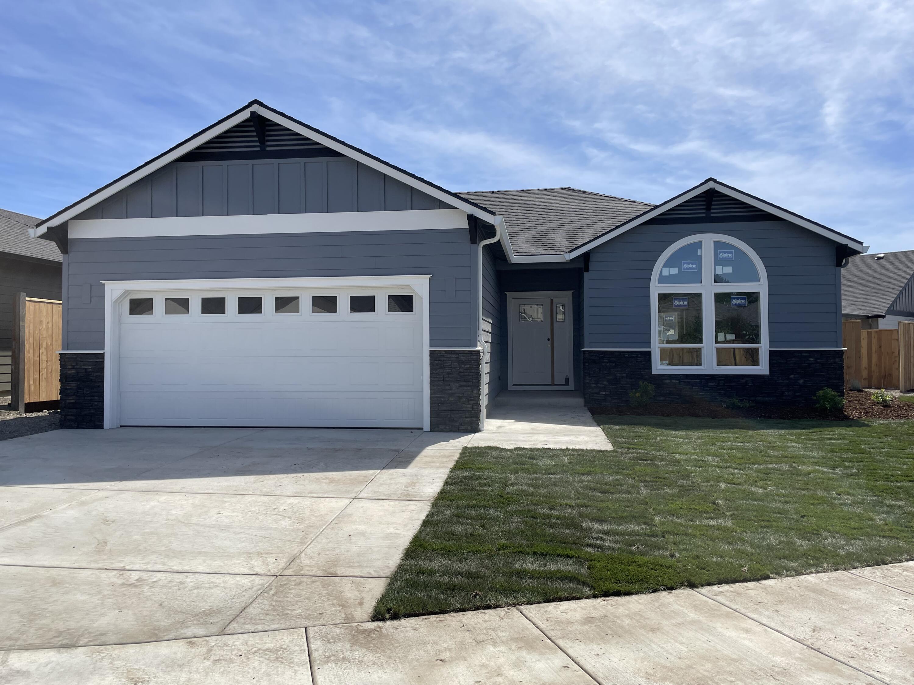 New Home Built by Horton Homes Inc. in a convenient East Medford neighborhood.  Our popular floor plan has an open concept for real living, 3 bedroom, 2 bathrooms, finished 2 car garage.  This home comes with Gas stove and furnance, granite counter tops, premium water proof laminate flooring, stainless steel appliances. Master bedroom has coffered ceilings and vaulted ceilings in Living room. 9 foot ceilings, Fence, and Landscaped, Gas stub out on back patio. One Year Builders Warranty included. Taxes are not based yet.  Listing agent is related to seller and builder.