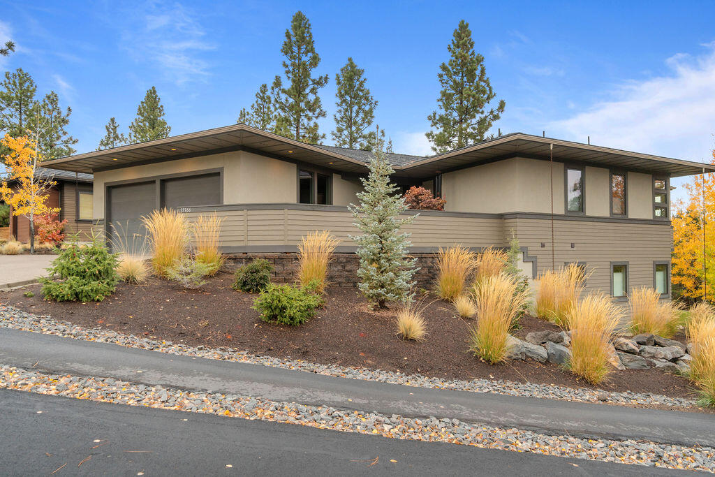 Located in highly desirable Three Pines Subdivision, this beautiful Prairie-style home is on a spacious corner lot overlooking treed open spaces, and a paved walking/biking trail to Bend's amazing 650 acre Shevlin Park.  Master and 2nd bedroom as well as a separate office/den are located on the main floor with their own private bathrooms and walk-in closets.  The Chef's kitchen features SS smudge proof professional appliances, hardwood floors, large island with quartz counter and beautiful views.  Downstairs is a large family room ( currently a library) with another primary bedroom including private bathroom and closets as well as tons of storage for all your toys.  This beautiful home is filled with light and you will love the private balcony off the living room as well as the welcoming enclosed courtyard when you enter the home.  The Floor plan is perfect if you want multi-generational living as well.  All in beautiful condition!