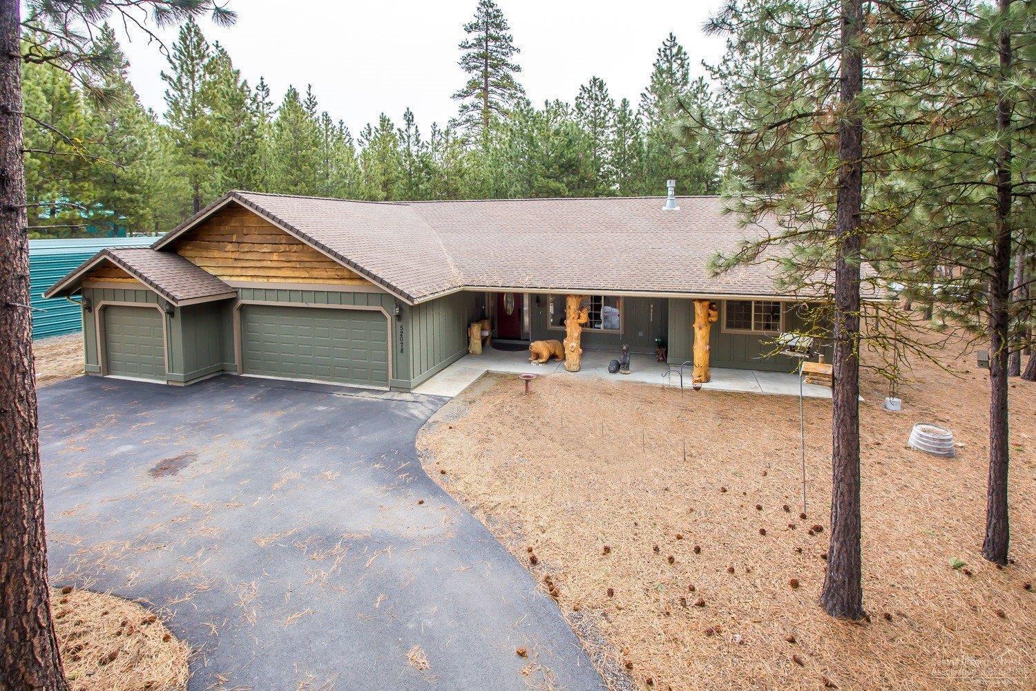 Beautiful custom home with oversized finished TRIPLE car garage attached. Wonderful Chef's kitchen, many custom upgrades, walk in pantry, walk in linen closet. Master separation with walk in shower, double vanity with lots of cabinet space, walk in closet, laminate flooring and lots of windows. Lg. Guest bdrm, Lg. office or 3rd bdrm. RV cover (12x36x10) Cover front and back decks, new style ATT septic system, community water, corner lot, paved circle driveway. Call to see today!