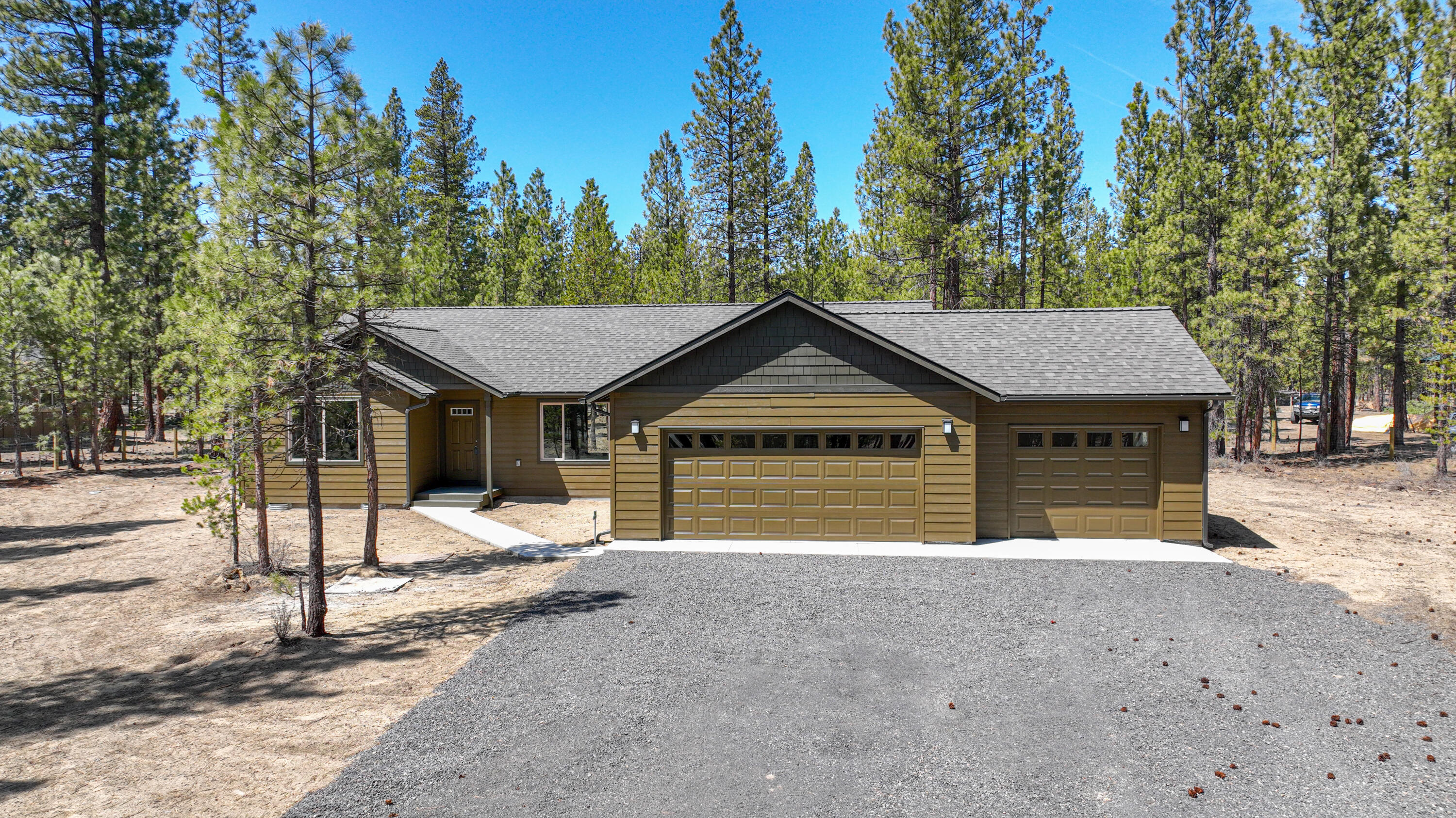 Central Oregon is growing fast; if you want a nice piece of land across from the Little Deschutes River and new construction this is the home for you! Nestled amongst the trees on 1.58 acre in the Little River Ranch subdivision this gated and fenced property leads you to the newly completed 3 bedroom 2 bath home featuring a 3 car garage. Quality finishes include a lovely kitchen with granite counter tops and stone backsplash, soft close maple cabinets with brushed nickel hardware, reed glass pantry door, under mount sink and stainless steel appliances a. The oven is even capable of air frying!  Wired for hot tub off of the back covered deck. Property has a back gate to access common area and National Forest where the deer and the elk are common sightings! The subdivision has two private trail access points to the Little Deschutes River; follow the trail and it will lead you to secret swimming holes to enjoy those hot summer days.