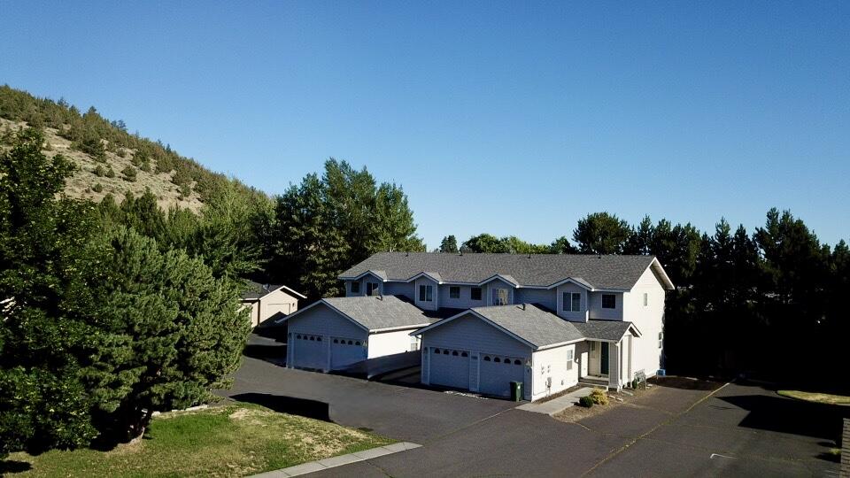 Seller financing available. Excellent location at Pilot Butte, one half mile from St. Charles Hospital. New roof and exterior paint in 2024. All units 2 BD/2.5 BA townhomes with single-car garages. 100% occupied with upside in rents.