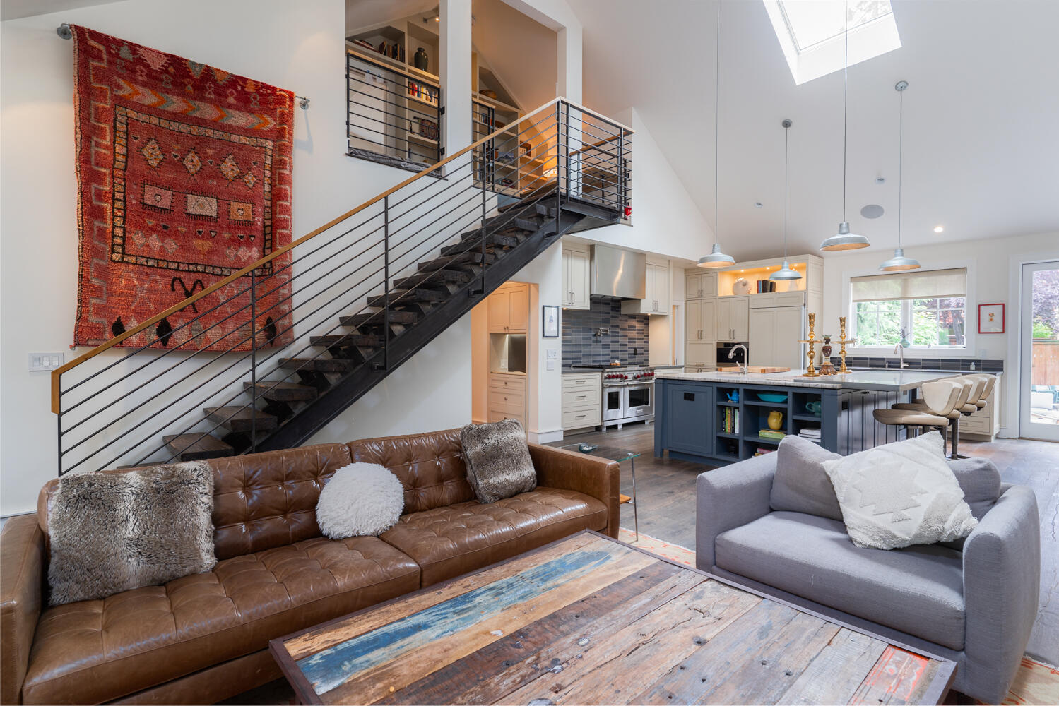 Located on a quiet street 2 blocks from the happening Galveston district, this beautifully renovated 3-bed, 3-bath home features a modern interior with high-end custom finishes, top-of-the-line appliances, abundant natural light, walnut cabinetry, & wide plank rough sawn oak floors. The chef's kitchen features an impressive 8.5' by 6.'5 concrete island, 48'' Wolf dual fuel range, Heath tile backsplash, & built-in eating area w/ bespoke lighting. Throughout, accent walls with artisan-crafted poplar create a radiant feel with timeless elegance. The first floor includes 2 bedrooms w/ 1 full bath and 1 ensuite, & a den. A custom reclaimed barnwood & steel staircase leads to the second floor primary suite with jacuzzi tub & steam shower, double-sided gas fireplace, paired closets, sitting area & add'l laundry room. The backyard oasis features mature trees, privacy, & an entertainment-ready space w/ a 54'' Wolf grill. This home is truly a retreat amidst the vibrant enclave of Galveston & 14