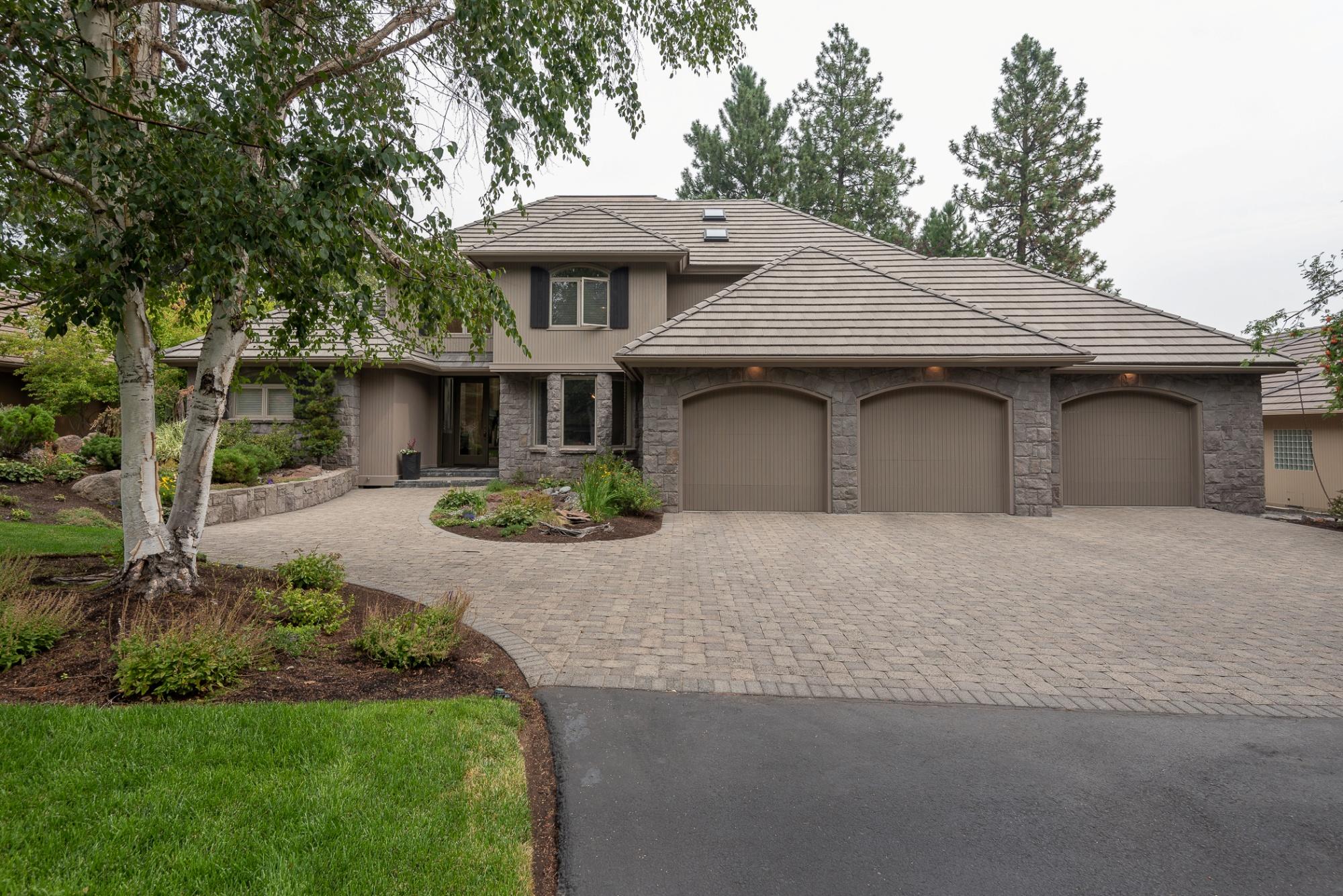Stunning home with gorgeous curb appeal & mature landscaping located on the 17th fairway of sought after Broken Top. Floor to ceiling windows invite the outdoors in. Entertainers delight with a large paver patio overlooking the pond. Beautifully updated, spacious kitchen is light filled and adjoins a breakfast nook overlooking the course and pond. New quartz counter-tops, new Dacor appliances and crisp white cabinetry make this kitchen a chef's dream. Luxurious main
floor master suite with a stylish new bathroom featuring double vanities, tiled shower, soaking tub and double closets. A spacious office attached to the master
boasts lots of light, built ins, patio access with golf course and pond views. Jr suite plus 2 bedrooms upstairs with a flex room and storage area. Oversized 3 car garage for all your toys. This home is truly a must see!