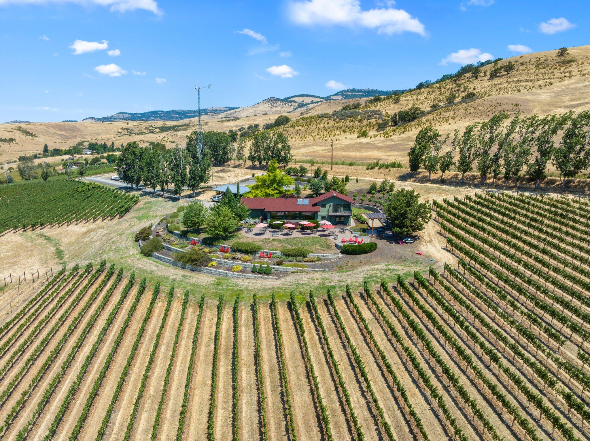 New lease-option and seller-carried financing terms available! Dana Campbell Vineyards is a legacy wine business offering multiple avenues for growth with unparalleled proximity to Ashland's renowned cultural amenities. Elegantly remodeled tasting room residence with panoramic valley views, great room with service bar and gas fireplace, catering kitchen, break room, ADA bathrooms, and three guest suites ideal for boutique hospitality. Landscaped grounds with expansive paver patio, outdoor speakers, gas fire pit, composite deck and pergola with retractable awning, bocce ball court, and rose garden. State-of-the-art cold storage facility or potential winery building with glycol system, irrigated acreage with southern exposure, 13,000+ established vines of eight estate-grown varietals producing 2,200 cases per year, seven additional acres ready for planting, wind turbine, frost fan, and all essential equipment for turn-key operations. Inquire for additional documentation and details!