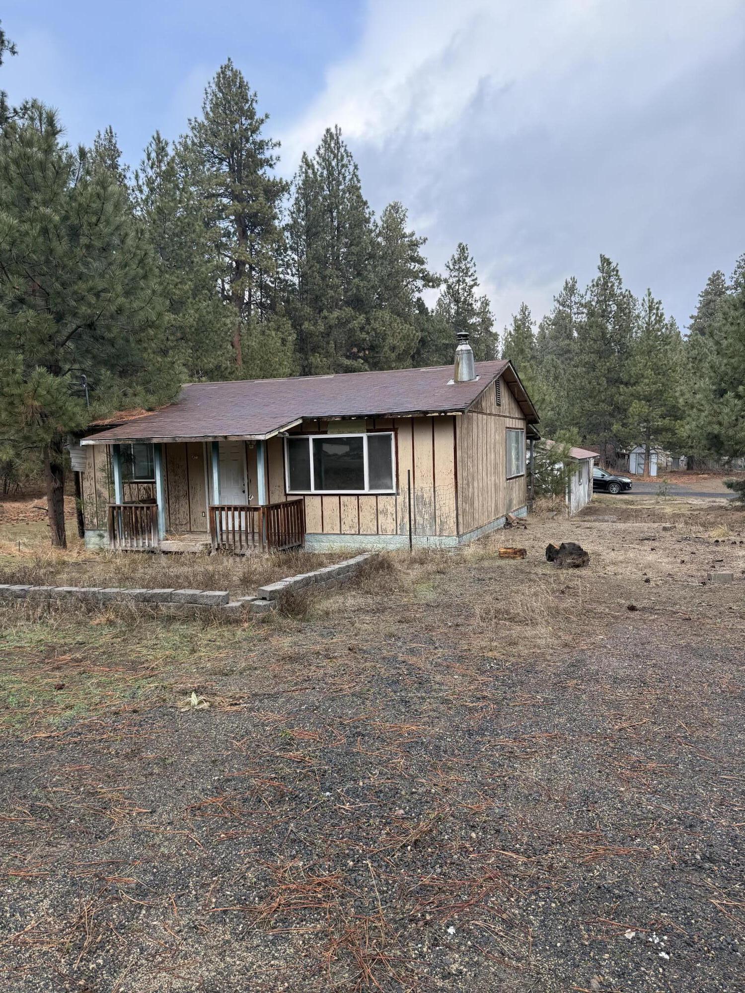Looking for peace in the pines? This property is located in Deschutes River Woods with convenient access to Bend, Mt. Bachelor, and nearby mountain lakes. Outdoor recreation including hiking, camping, and exploring is right outside your door. Situated on nearly an acre with utilities in place, the property includes an existing 2 bedroom, 1 bathroom residence built in 1976 and offers an opportunity for a fixer-upper or future plans.