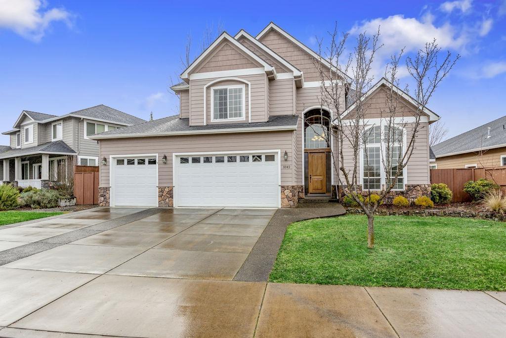 Attention to detail!! Beautiful Eagle Point Golf Course home welcomes you with soaring ceilings, grand entry staircase and hardwood floors. The well-appointed kitchen makes it easy to entertain with gas cooktop, double ovens, granite countertops, large island, newer SS appliances, pantry, tons of cabinetry with a built-in desk space. Out back you'll enjoy the large stamped concrete patio, rock fire pit and raised garden beds. An added bonus is the Oversized 3 Car Garage; perfect for your golf cart. The well-designed floor plan boasts both formal and informal living & dining spaces. The formal living is complete with a rock gas fireplace. All bedrooms are nice sized. Master suite with double door entry and coffered ceiling detail leads you to the gorgeous master bath featuring large jetted tub, dual sinks, double headed tile shower and walk-in closet. This home does not disappoint.