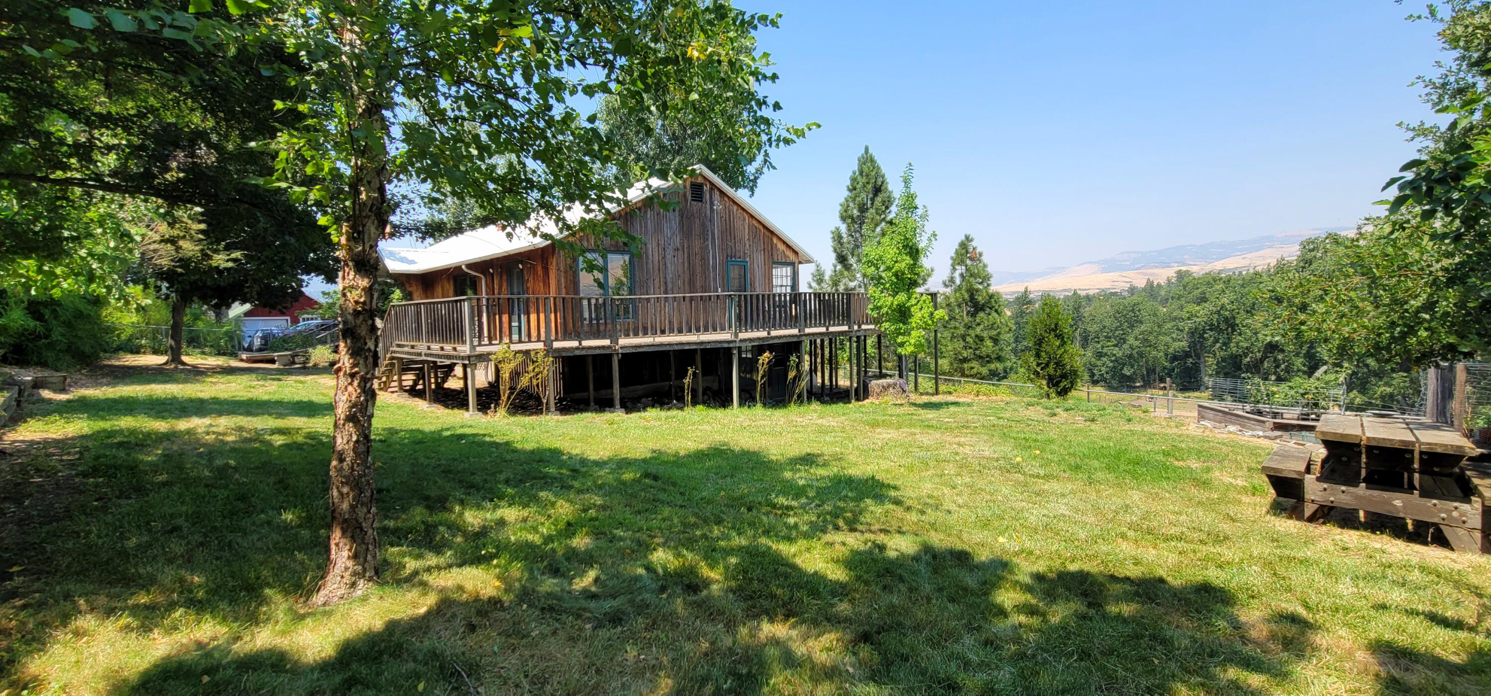 Incredible Opportunity! Extraordinary property offers perfect blend of seclusion and accessibility, minutes from vibrant downtown Ashland. Cherished by the same family for over 40 years, estate spans 10.83 ac across 3 tax lots, zoned EFU, bordering Ashland's urban growth boundary and North Mountain Park & Nature Center. Bear Creek adds serene beauty and abundant wildlife to the property. Irrigated with TID, ensuring ample water for all your agricultural needs. Recent Home-site Approval on TL #4000-2700 provides incredible development opportunities. TL #4100 features a charming 1920s farmhouse 4 bd/2 ba, daylight basement, and utility rooms. This vintage home presents an exciting project for restoration enthusiasts, complete with city water and sewer. The property is well-equipped for agricultural or hobby farming endeavors, featuring a barn, chicken coop, corral area, and shed.  As-Is Sale allowing you to reimagine this magical setting!