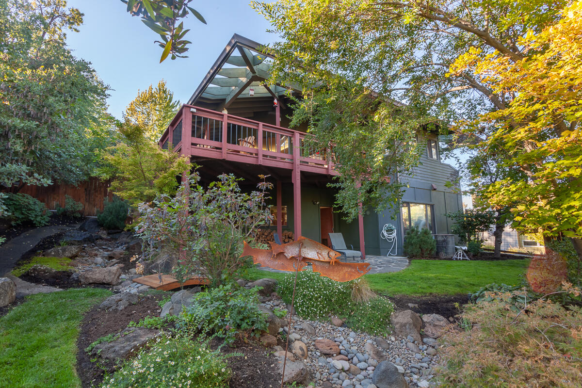 Best location for this gracious, beautifully, and extensively remodeled contemporary home, just minutes to the Plaza and Lithia Park! Private, quiet setting, with stunning views on .39 acre. All living is on the main level. Plus, new owner parking added, adjacent to the main level, for easy access. Amenities include interesting architectural features; high or vaulted, wood ceilings; walls of windows for maximum light; hardwood and stone floors; a chef's kitchen; a spacious living room with slate fireplace; a separate dining room; and 3 bedrooms, each with an en-suite bath. The property has its own irrigation well to keep everything lush and green, a water feature and multiple new decks and a hot tub/gazebo for prime outdoor living!