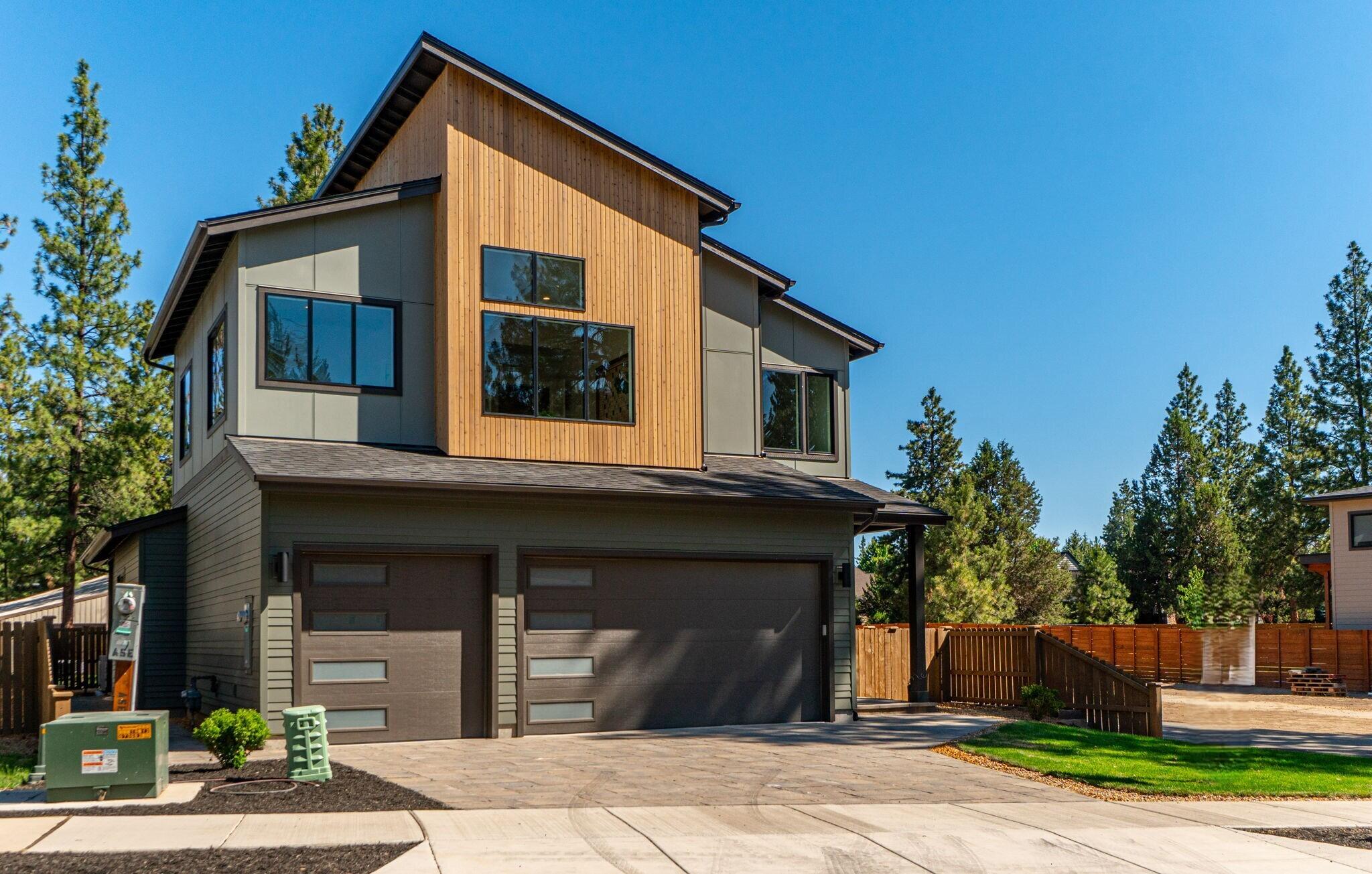 2024 COBA Tour of Homes Award Winner! Recognized for Best Architectural Design, Best Feature (ADU), Best Value, and Best in Show, this new home by RD Building & Design is a mountain modern marvel with 3,197 sq ft of refined living space. This unique residence seamlessly integrates 4 bedrooms and 3.5 bathrooms, including a versatile attached ADU that features one of the bedrooms, perfectly designed to serve as a main-level primary suite or a separate living area for guests. The spacious bonus room is ideal for an extra bedroom, home office, or entertainment space. Enclosed by a fully fenced and landscaped yard, this property offers privacy and tranquility. Experience comfort and convenience with features like air conditioning, tankless water heaters for both the main residence and ADU, and a 3-car garage. The primary suite in the main house is a sanctuary of luxury, complete with a dual-head walk-in shower and a deep soaking tub for ultimate relaxation.