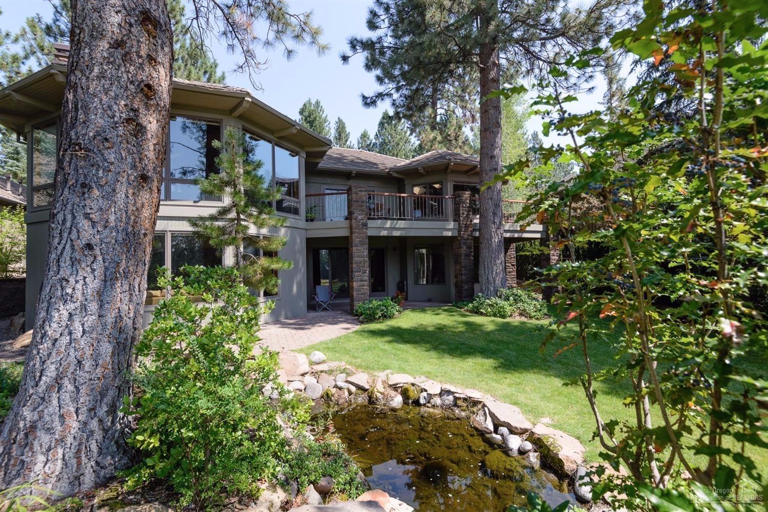 Beautiful mountain style home overlooking the Broken Top 4th green and lake. Impressive great room with a rock faced, wood burning fireplace. Floor to ceiling windows invite the outdoors in. Spacious dining area opens to a lovely deck with beautiful views. Chef's kitchen with solid counters,breakfast bar and island, walk in pantry and dining nook. Main level master retreat. 3 guest suites and bonus room, exercise room down, 3 car garage.